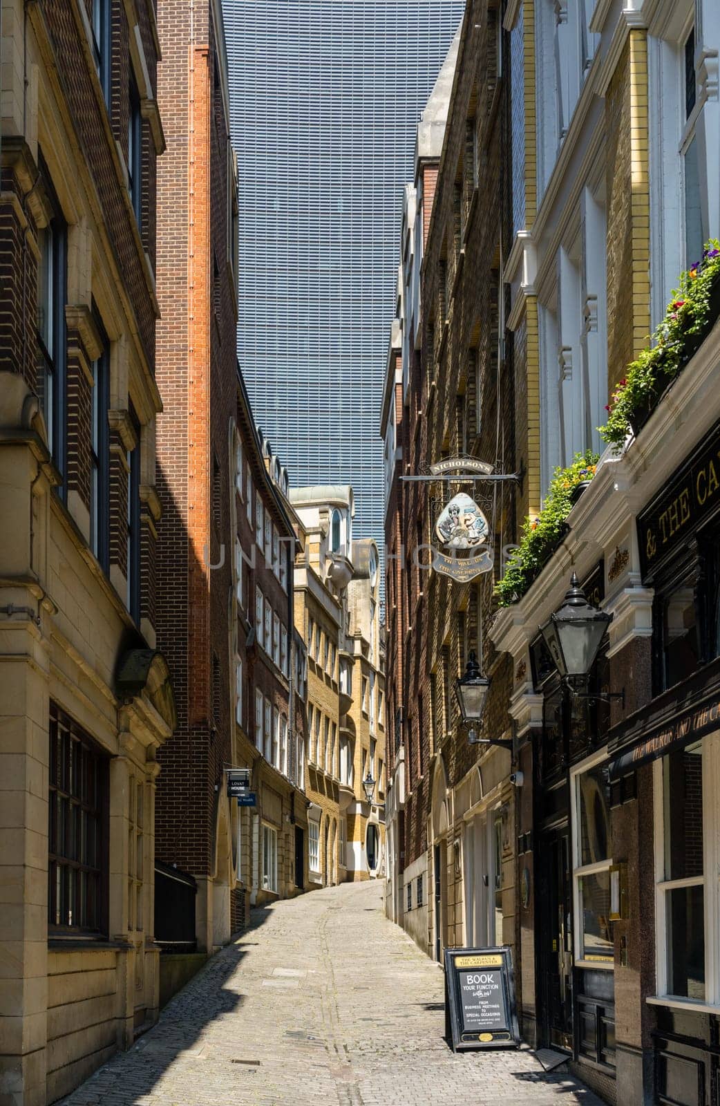 Lovat Lane in the City of London with skyscrapers filling sky by steheap