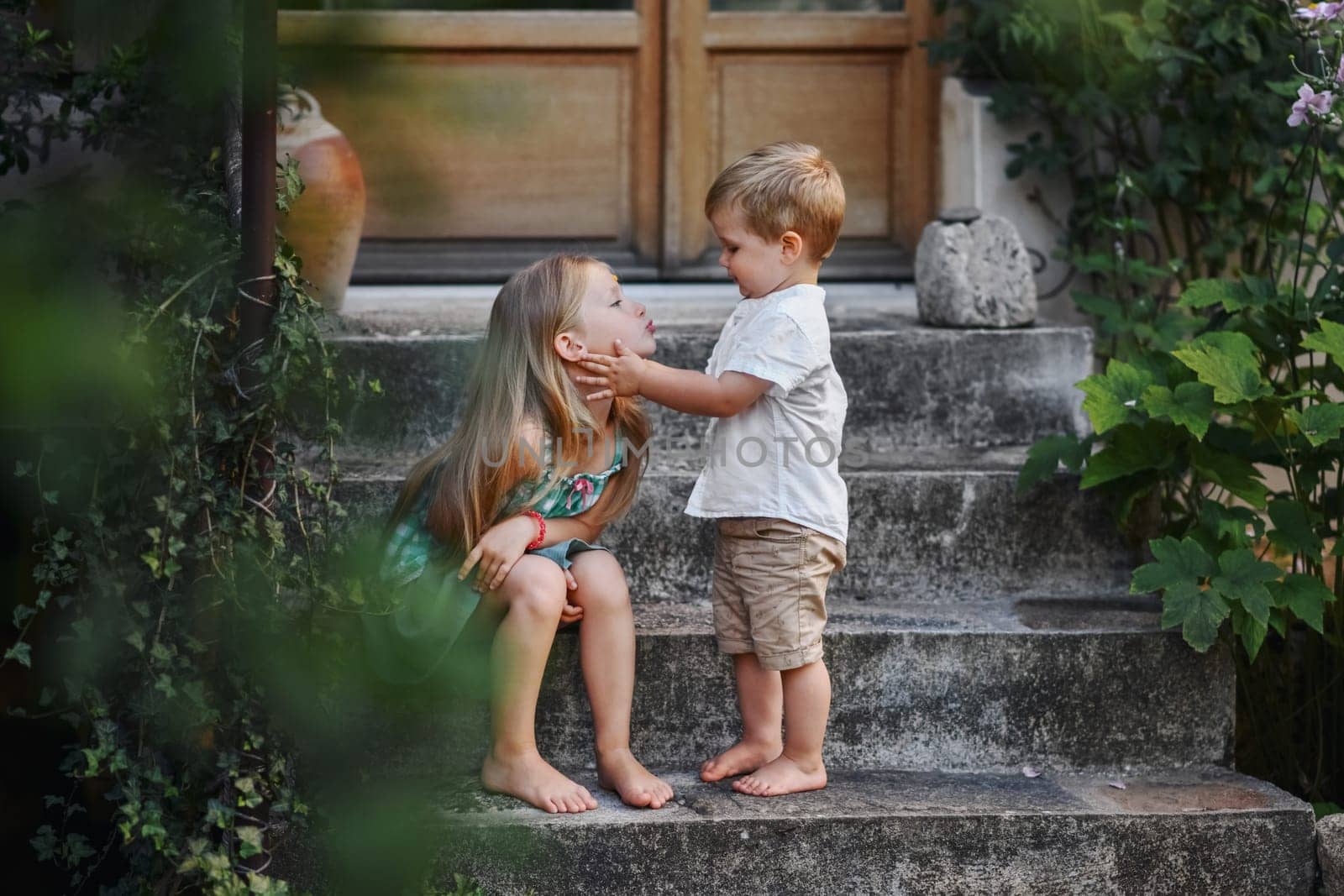 happy sister and brother together in the summer yard