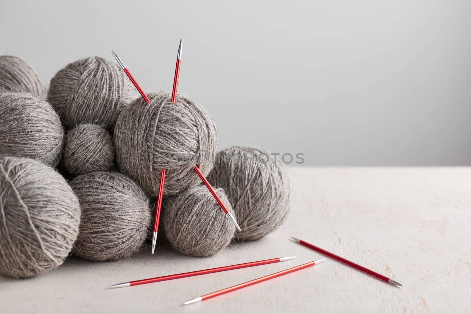 Double pointed knitting needles and balls of yarn by maxcab