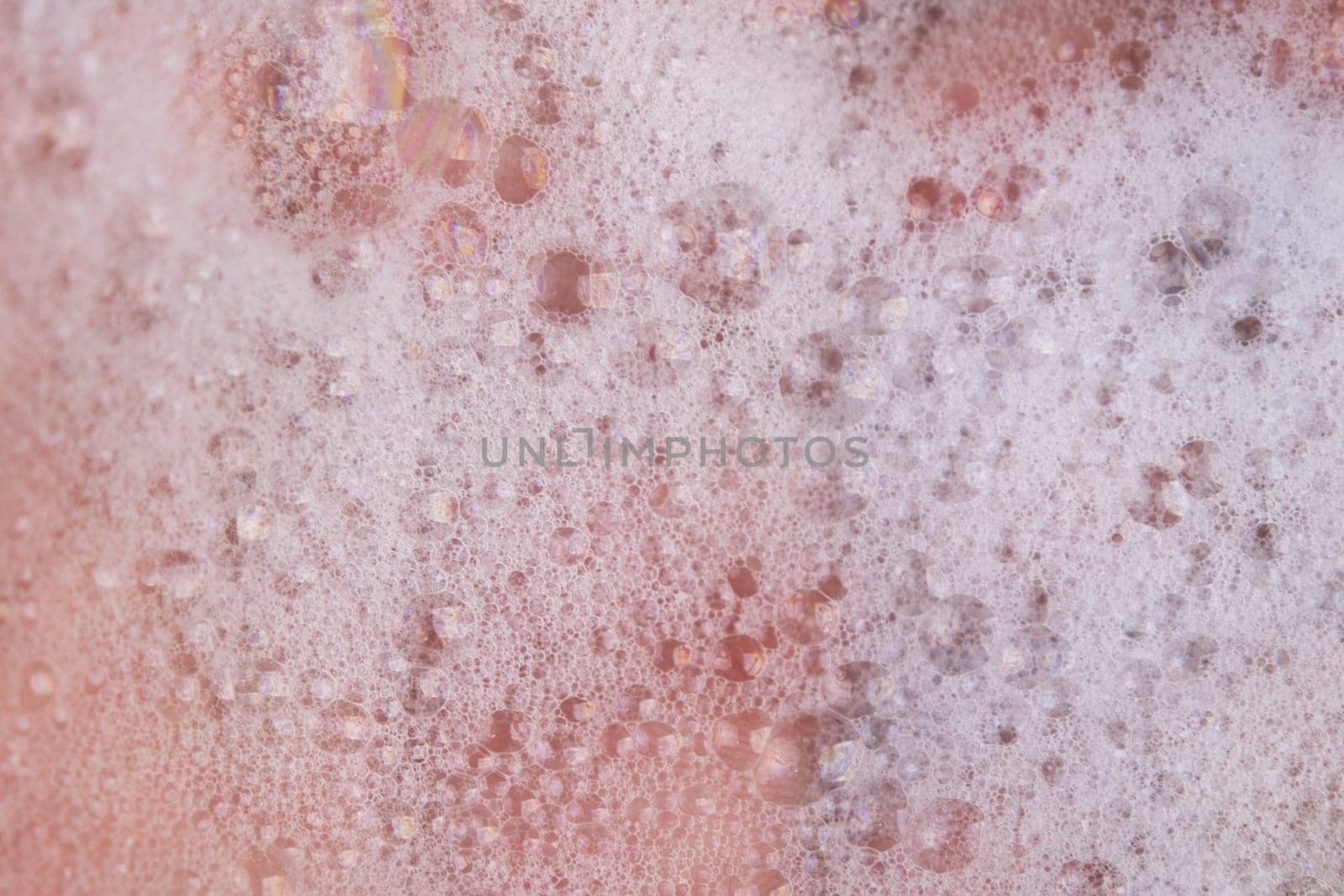 Texture of white soap foam with abstract soap bubbles background.