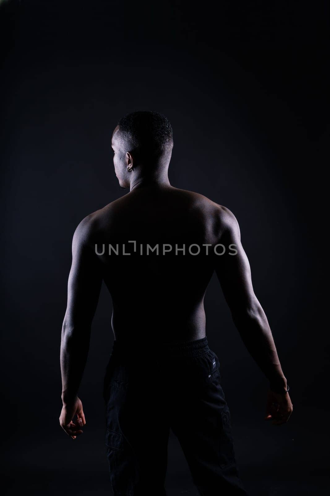 Muscle, body and skin, portrait of black man on dark background with serious face for art aesthetic. by Zelenin