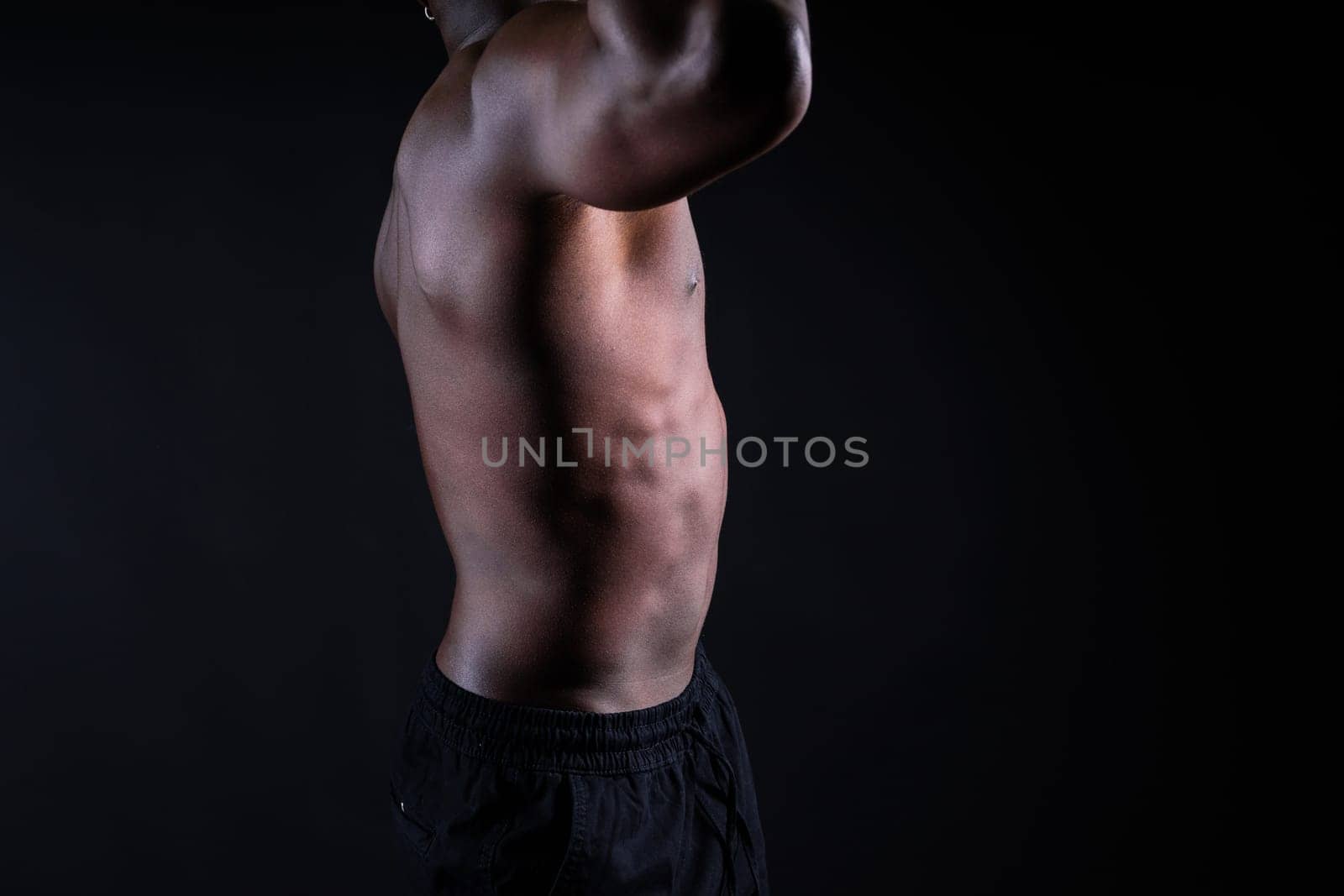 Muscle, body and skin, portrait of black man on dark background with serious face for art aesthetic. by Zelenin