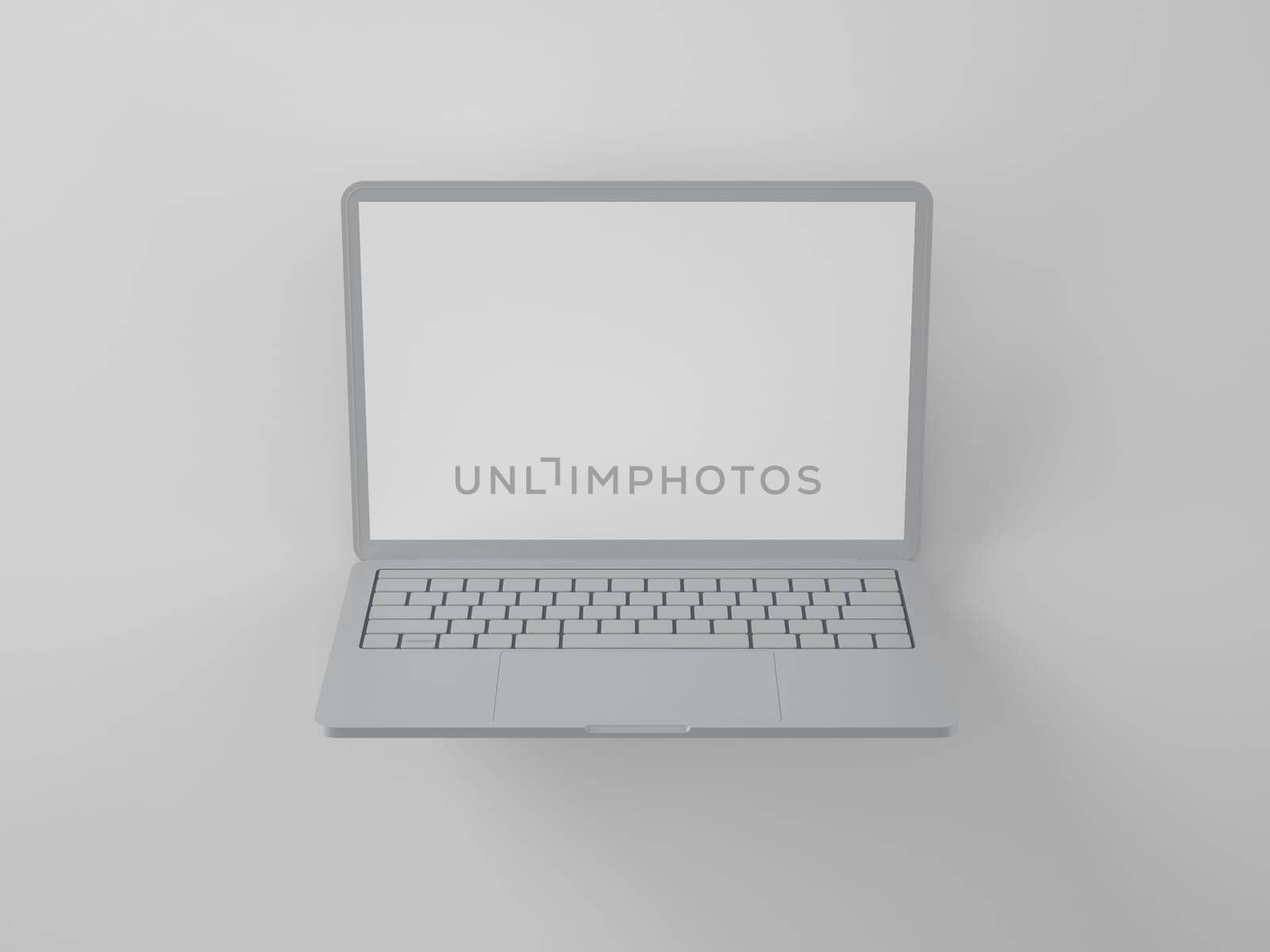 Open modern gray laptop with a blank screen on a light background