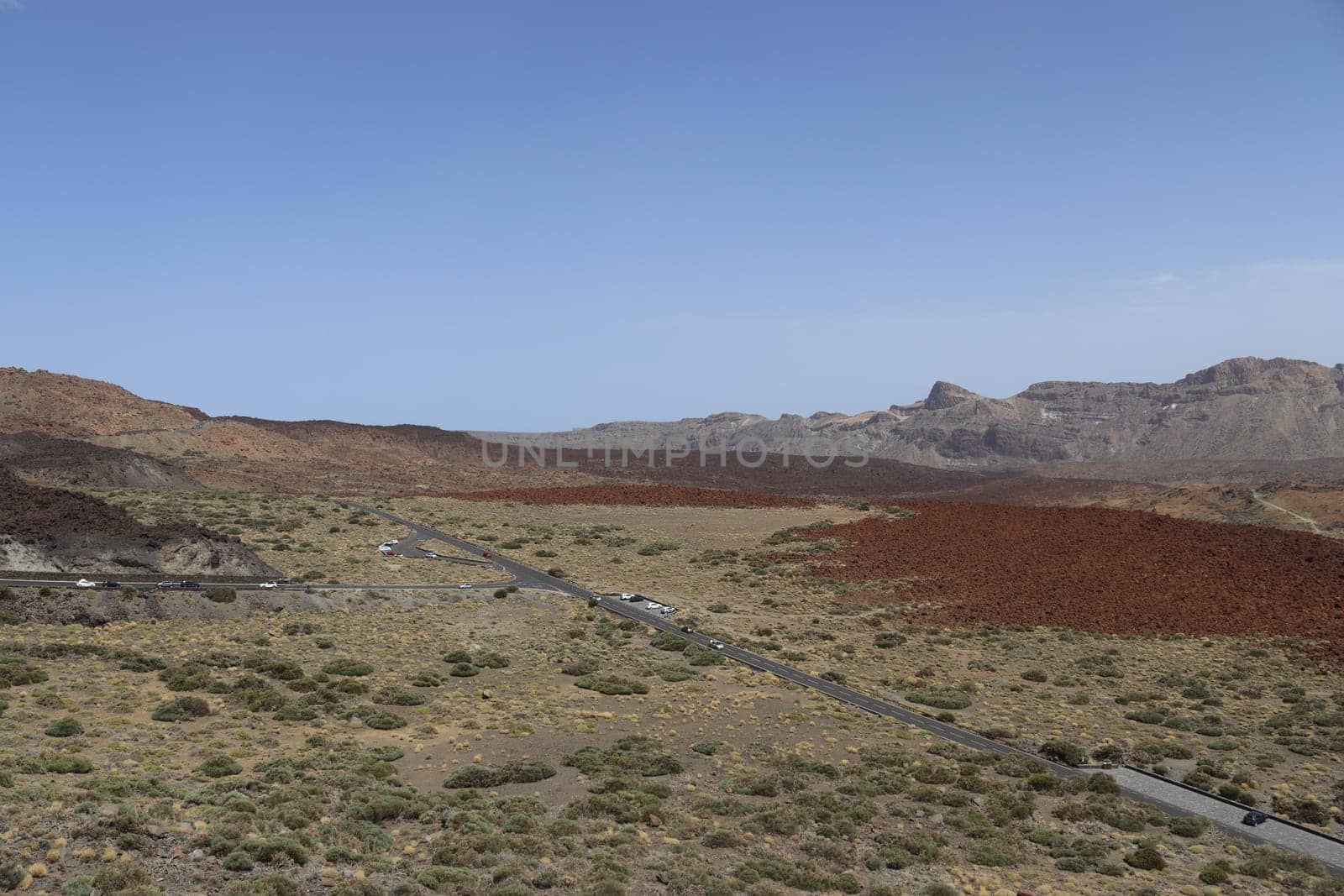 Panoramic view of volcanic lanscape in front of the ocean from the peak of mountain Teide, Tenerife, Canary islands, Spain