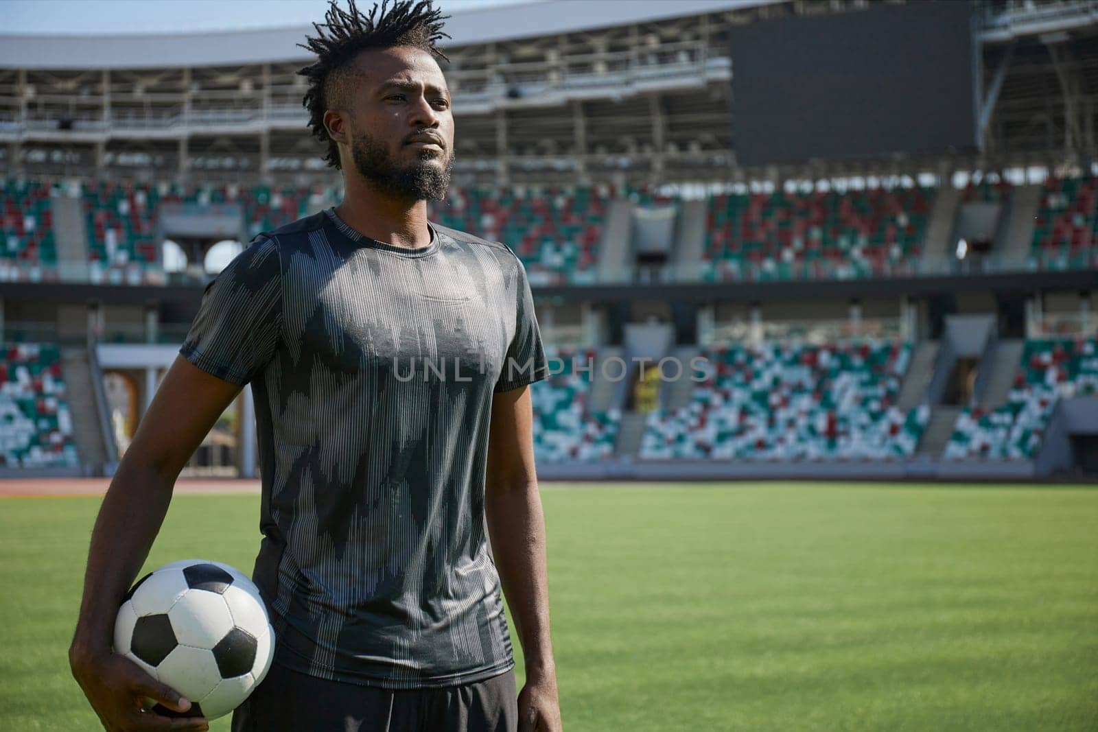 African American soccer player during match inside large stadium