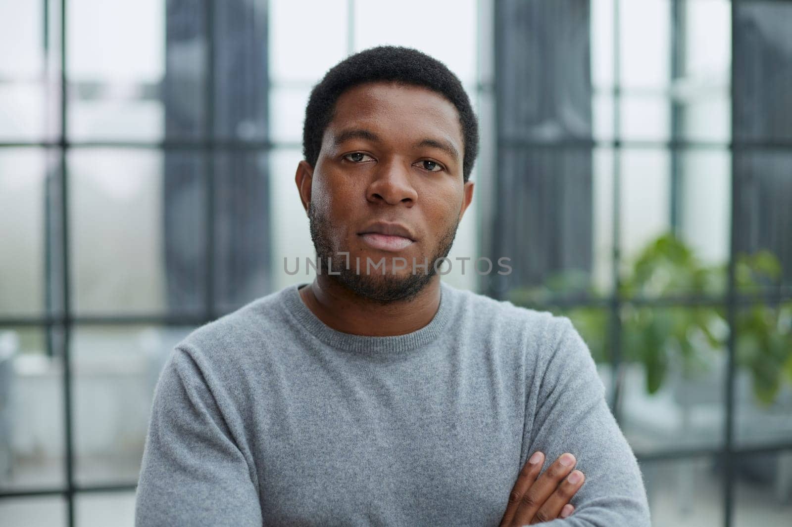 confident black guy posing for headshot face front close up portrait.