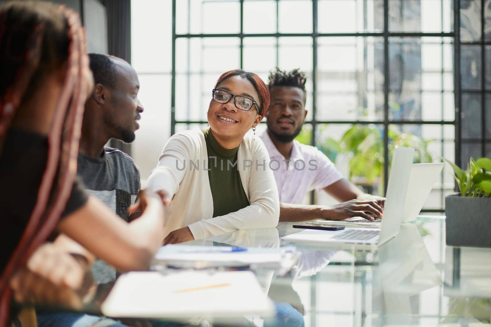 african business people handshaking at modern office