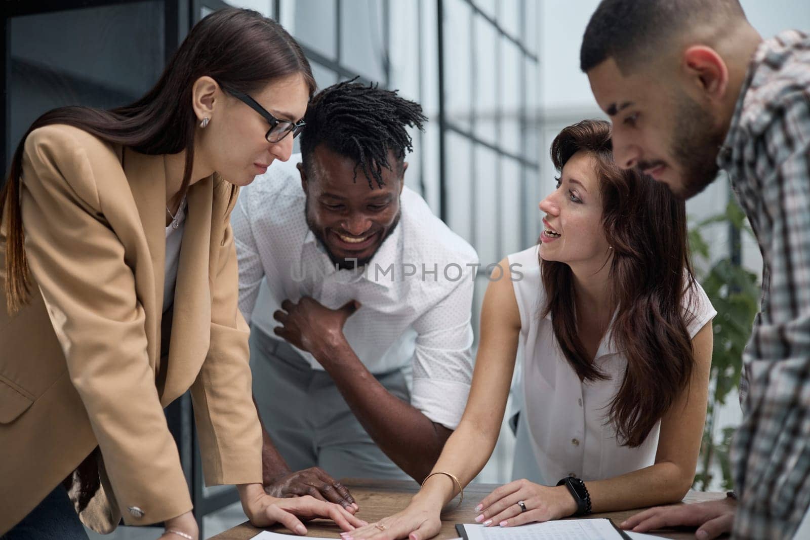 Ambitious smart employee speaks in a meeting and shares her opinion on a creative idea in a group briefing