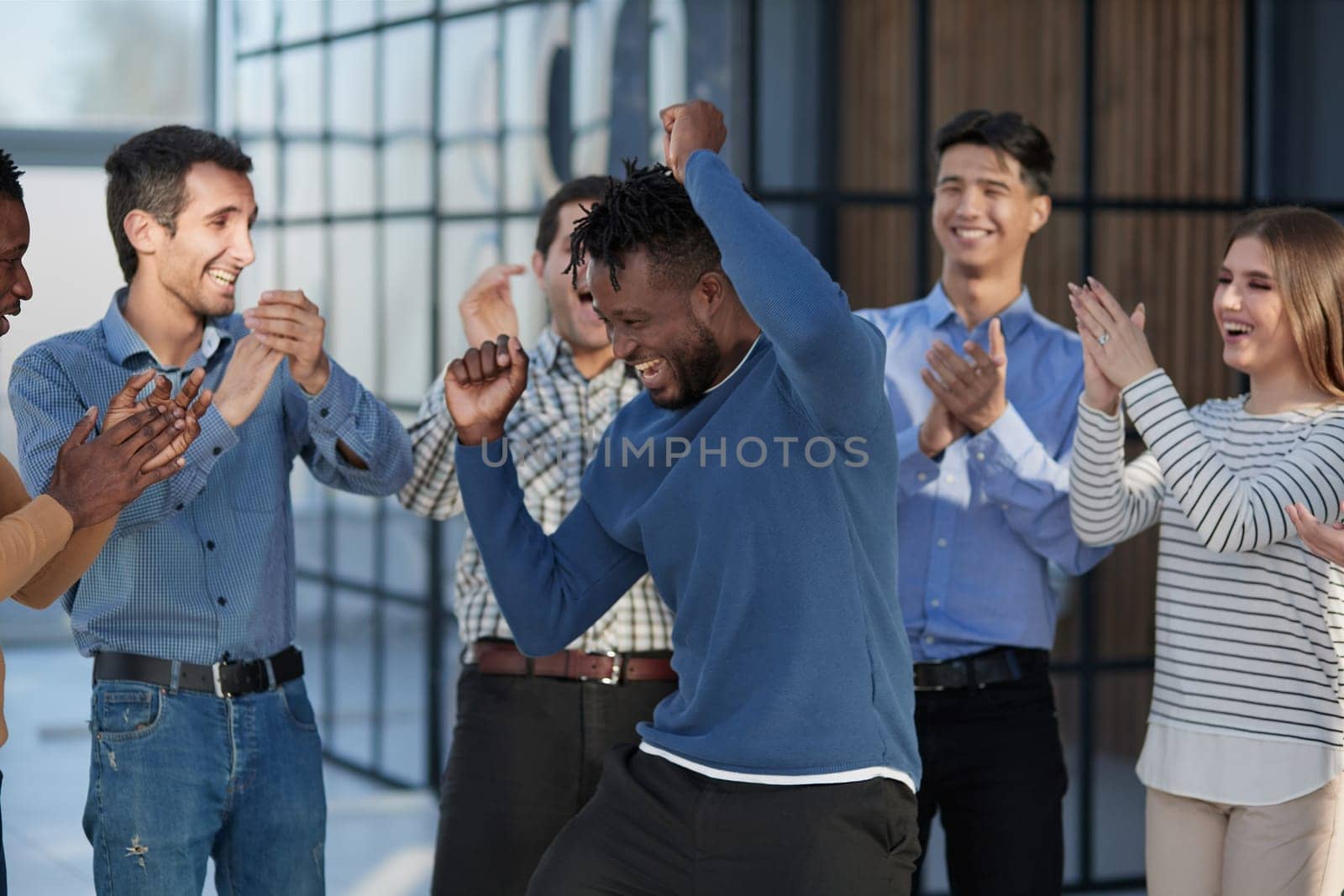 happy multiracial colleagues coworkers celebrate business success together