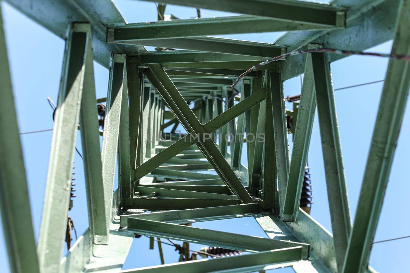 Looking up small power pylon.