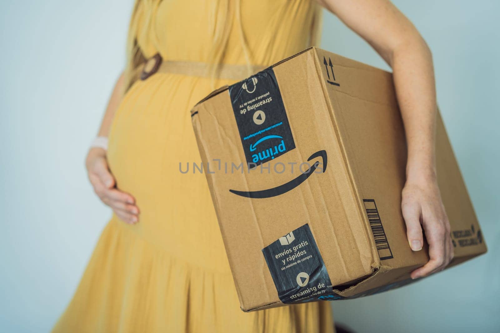 12.21.22, Mexico, Playa del Carmen: A pregnant woman received a package from Amazon. Products for pregnant women and babies on Amazon by galitskaya