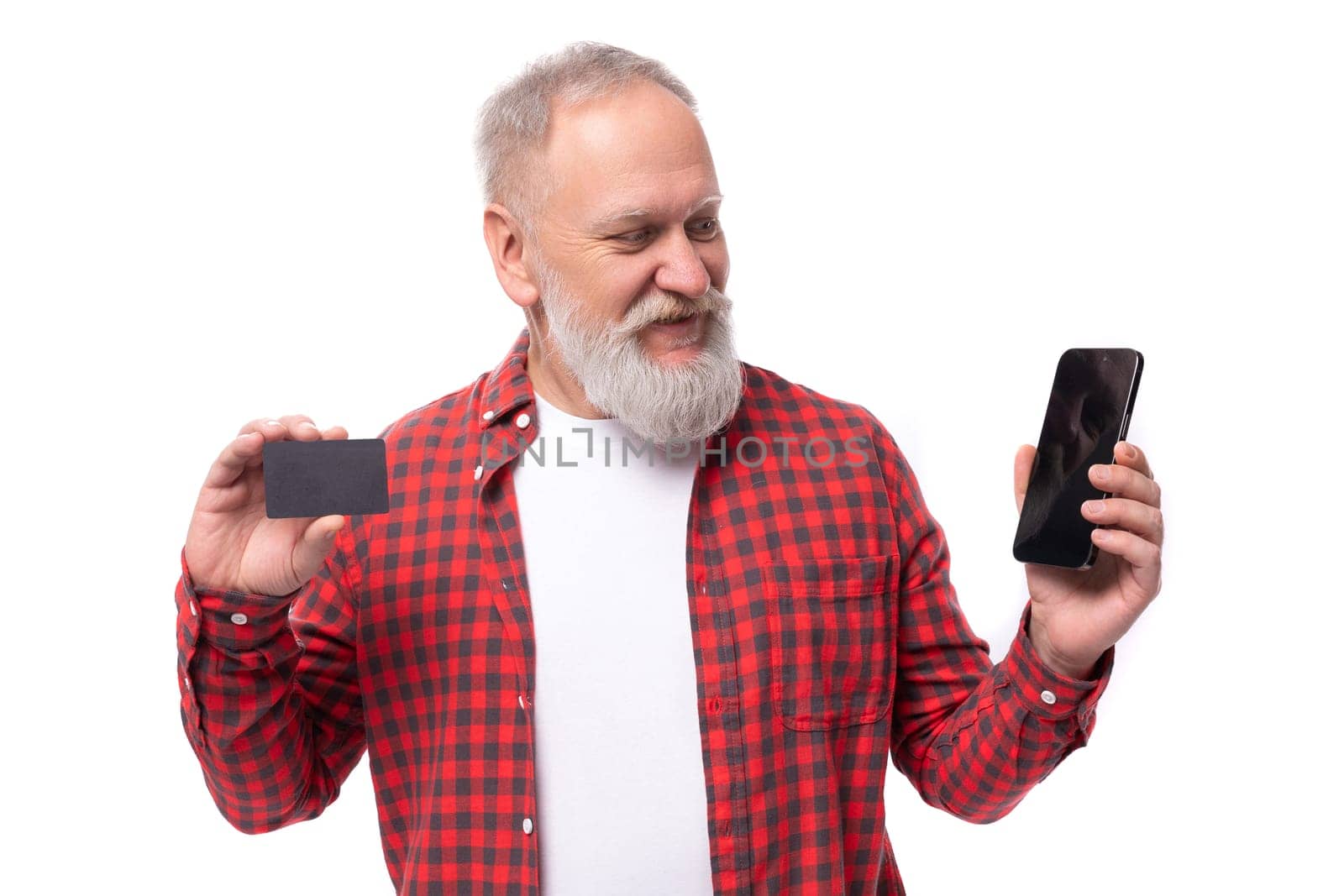 handsome 60s retired man with white beard and mustache showing bank card by TRMK