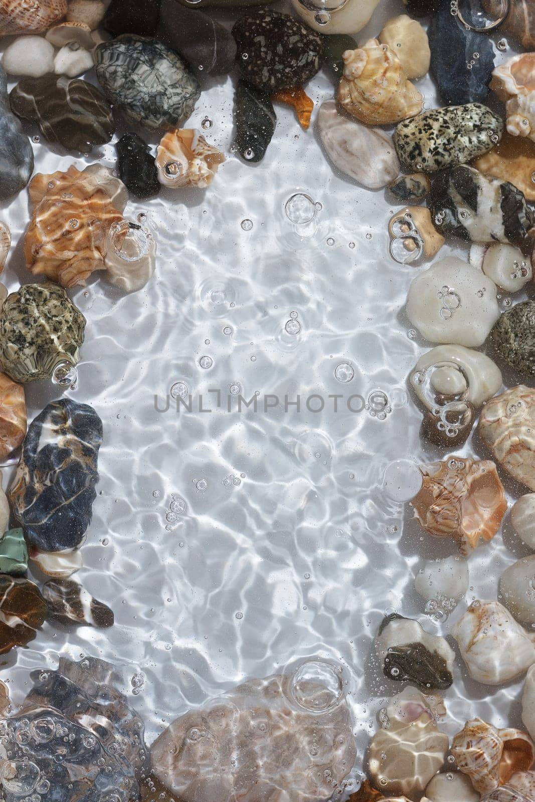 background from sea stones and water. copy space,vertical photo by lara29