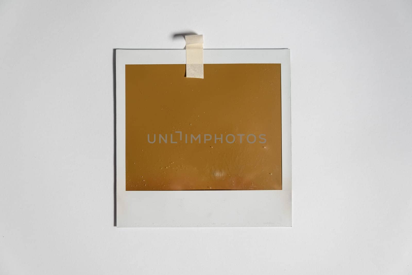 Download Blank photo frame template on white background. Blank square photo frame on wall copy space by igor010