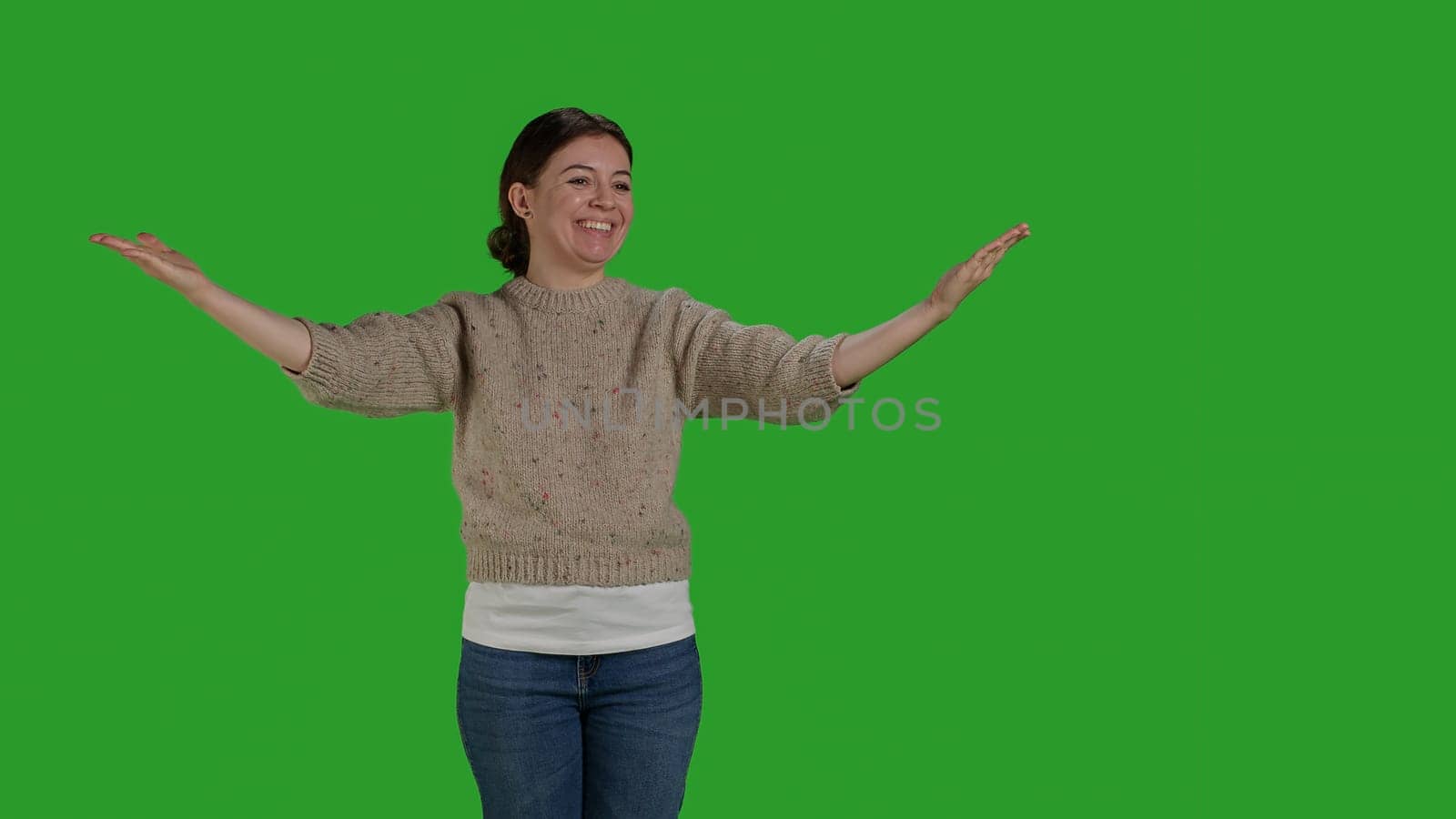 Front view of woman blowing kisses in studio to show love by DCStudio