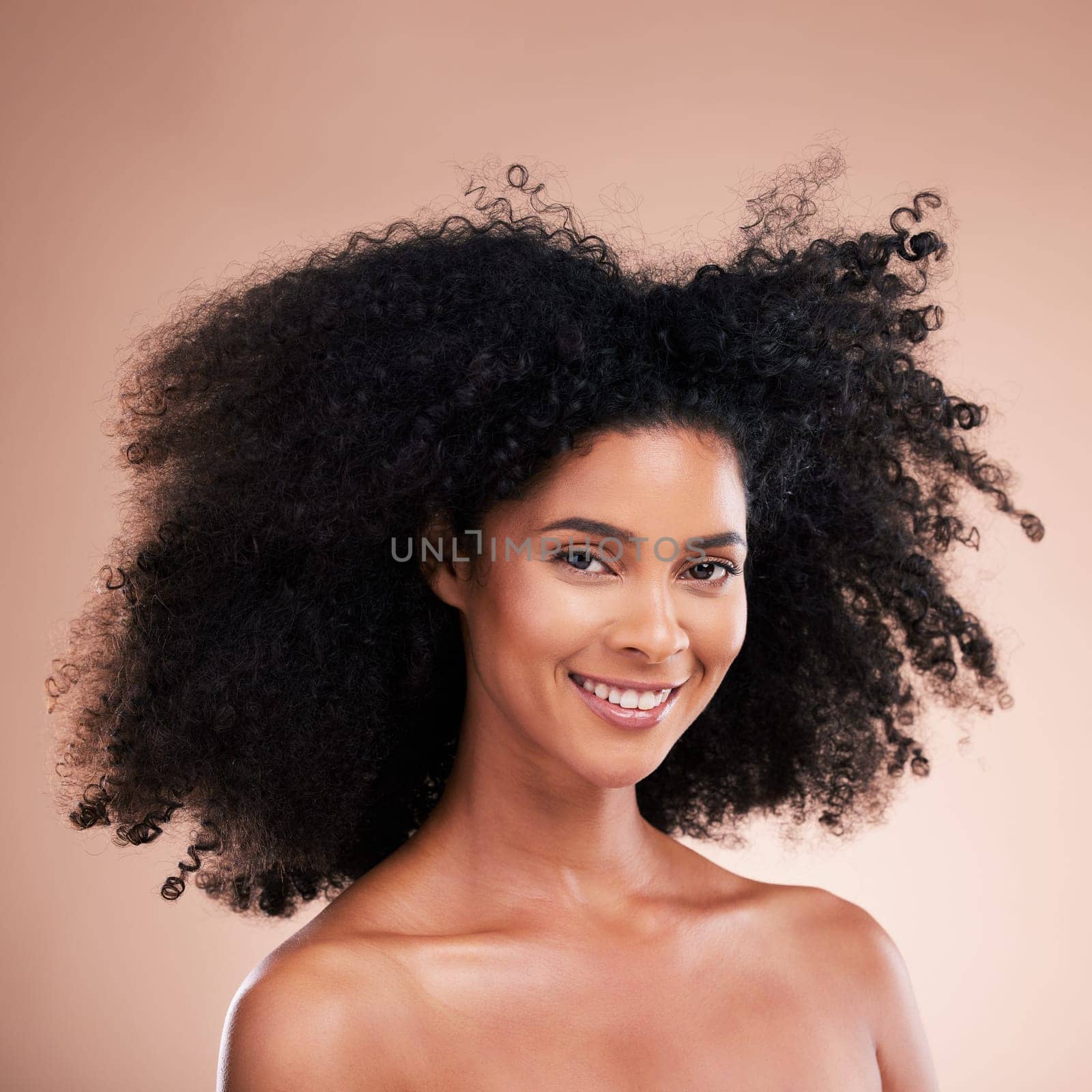 Happy black woman, portrait or afro hair on studio background in aesthetic empowerment, curly texture pride or skincare glow. Beauty model face, smile or natural hairstyle and makeup on isolated wall by YuriArcurs