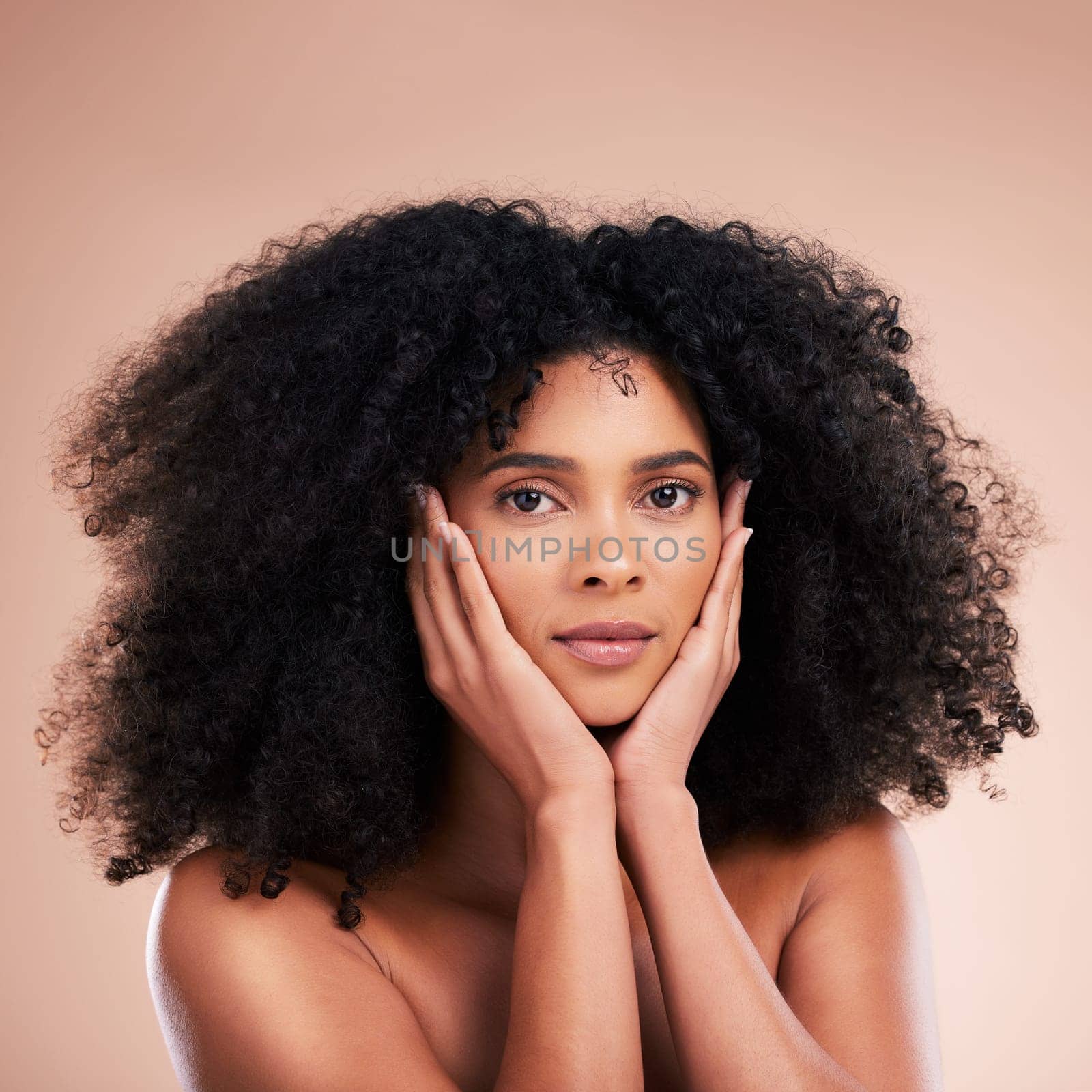 Black woman, portrait or afro hair with hands on face in aesthetic empowerment, curly texture pride or skincare glow. Beauty model, natural or hairstyle ideas and makeup on isolated studio background by YuriArcurs