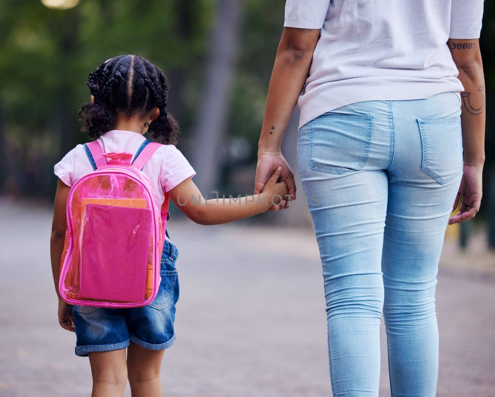 Holding hands, mom and child walking to school, help and care with support outdoor, education and growth. Kindergarten, development in childhood and backpack, family, woman with girl in the morning by YuriArcurs