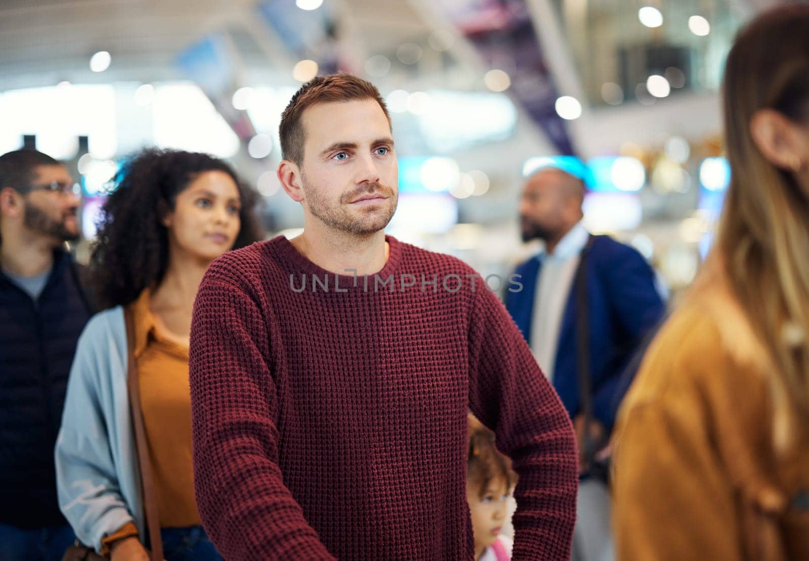 Travel, queue and serious with man in airport for vacation, international trip and tourism. Holiday, luggage and customs with passenger in line for ticket, departure and flight transportation.