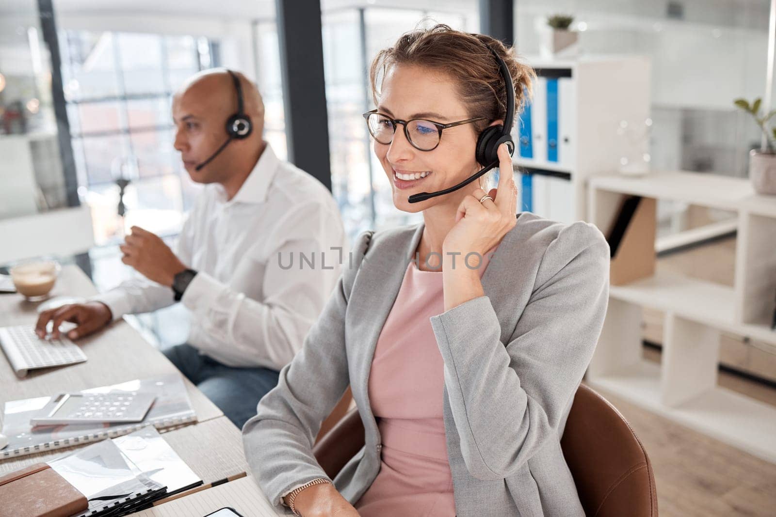 Call center, support and worker consulting, talking and giving customer service online for telemarketing. Crm, contact us and happy employee in technical support at a corporate communication agency by YuriArcurs