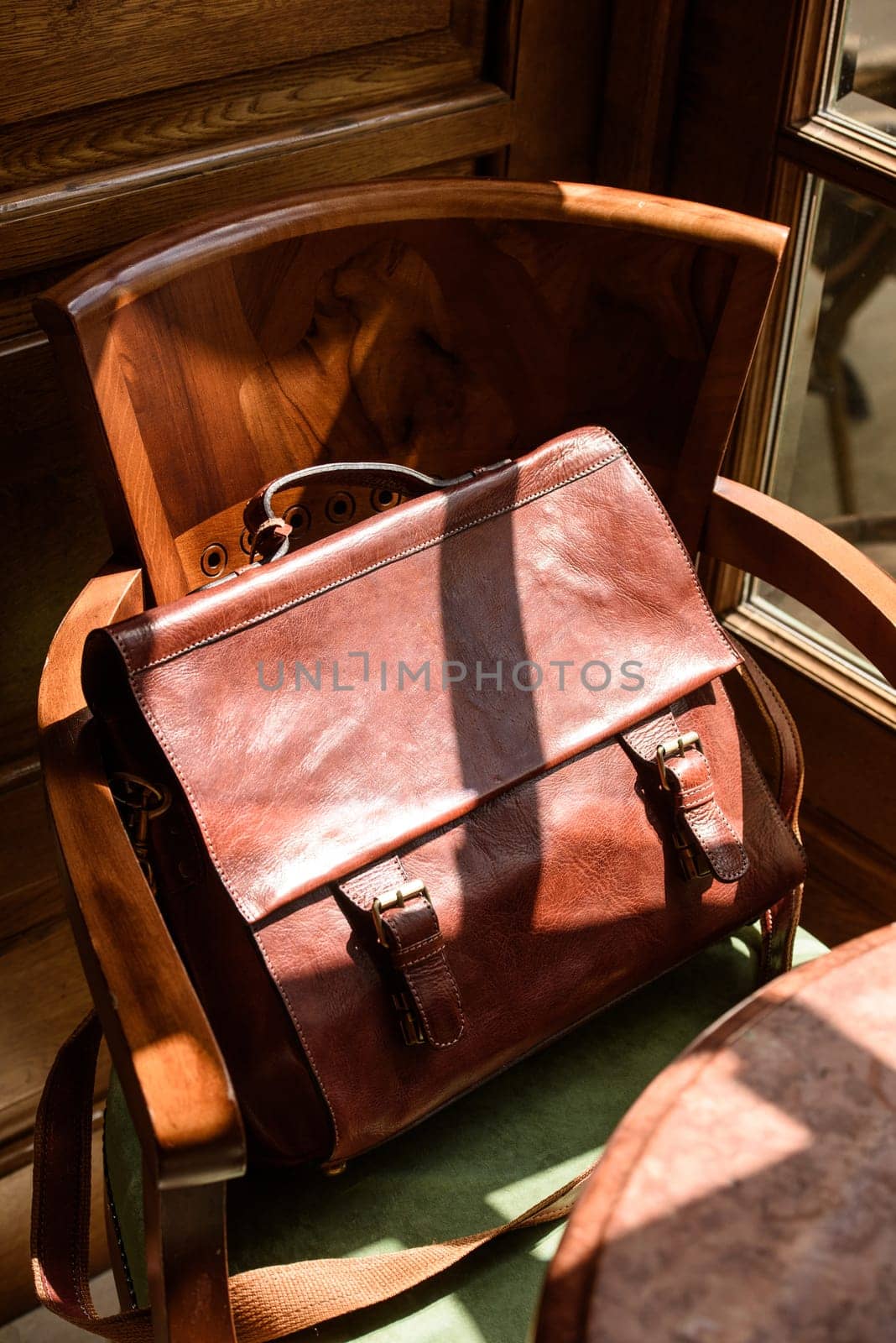 close-up photo of orange leather bag corporate. Indoor photo