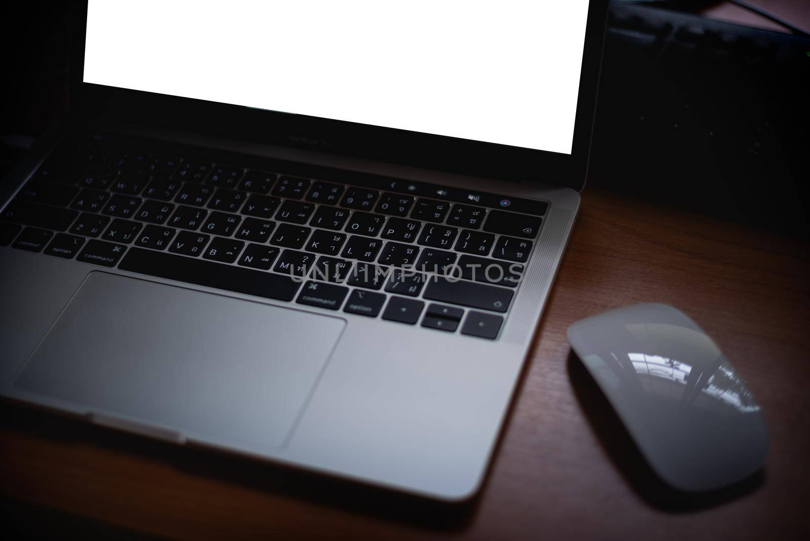 mouse and laptop on the office table by Wmpix