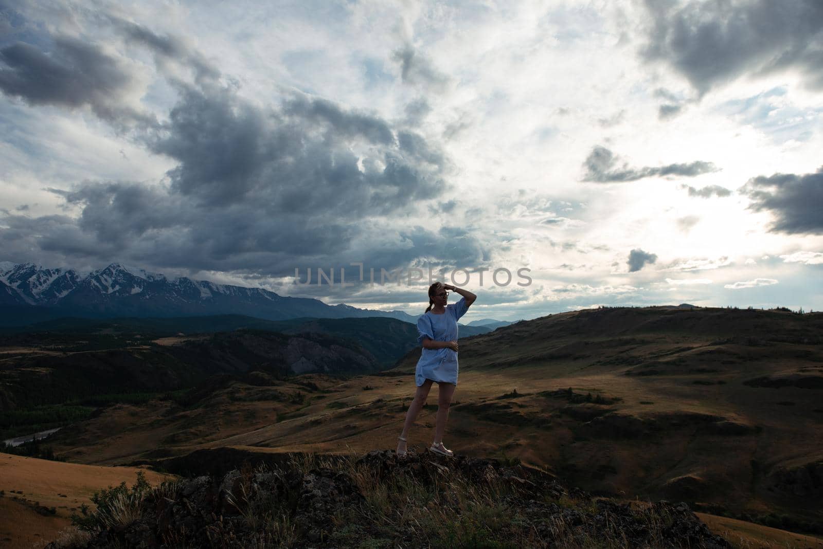 Woman in blue dress in summer Altai mountains by rusak
