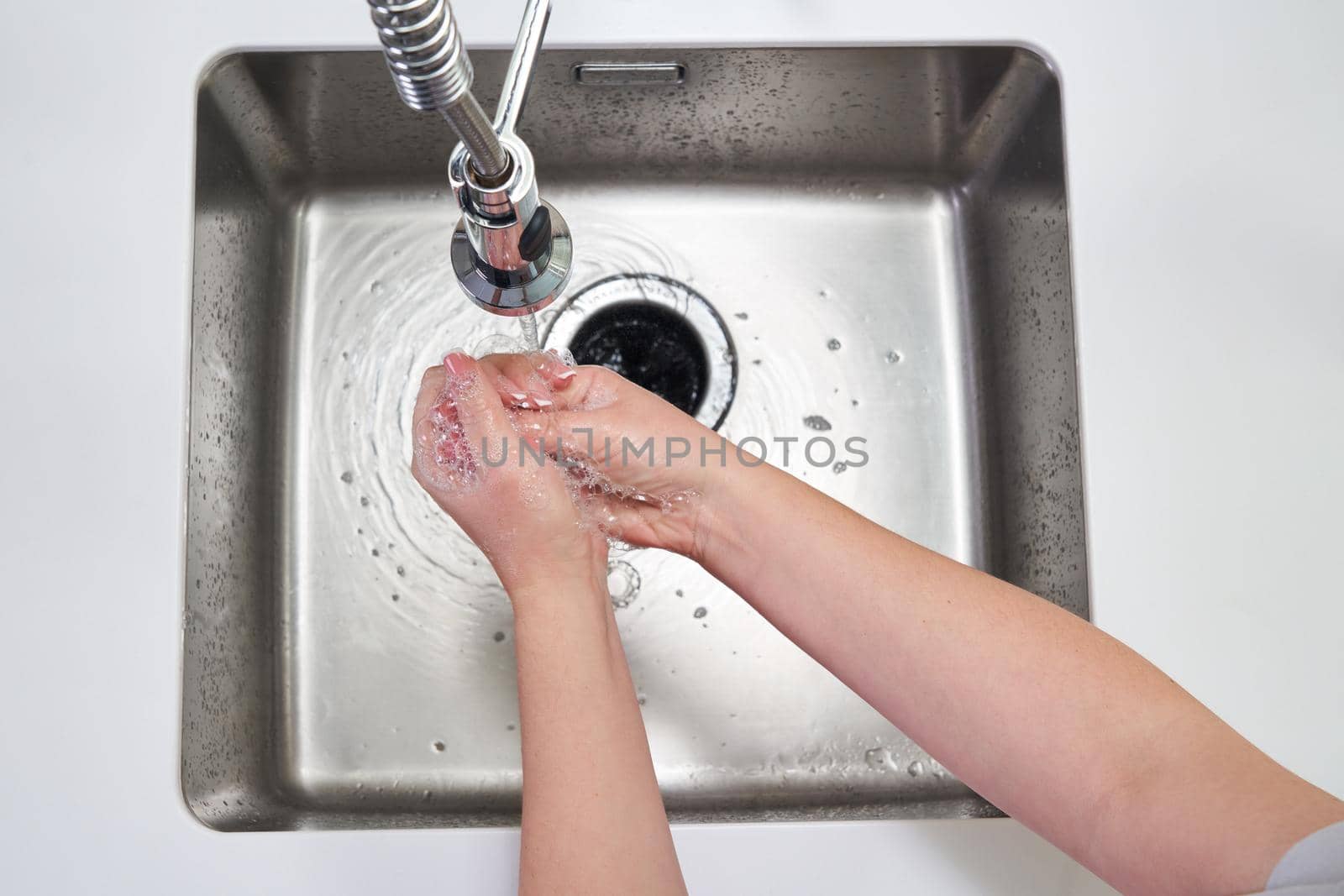 Woman washing hands with antibacterial soap for corona virus prevention, hygiene to stop spreading coronavirus covid19