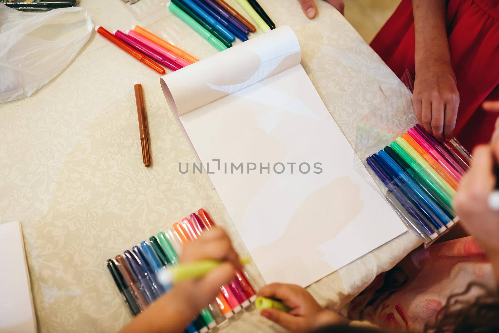 Children drawing with markers and having fun