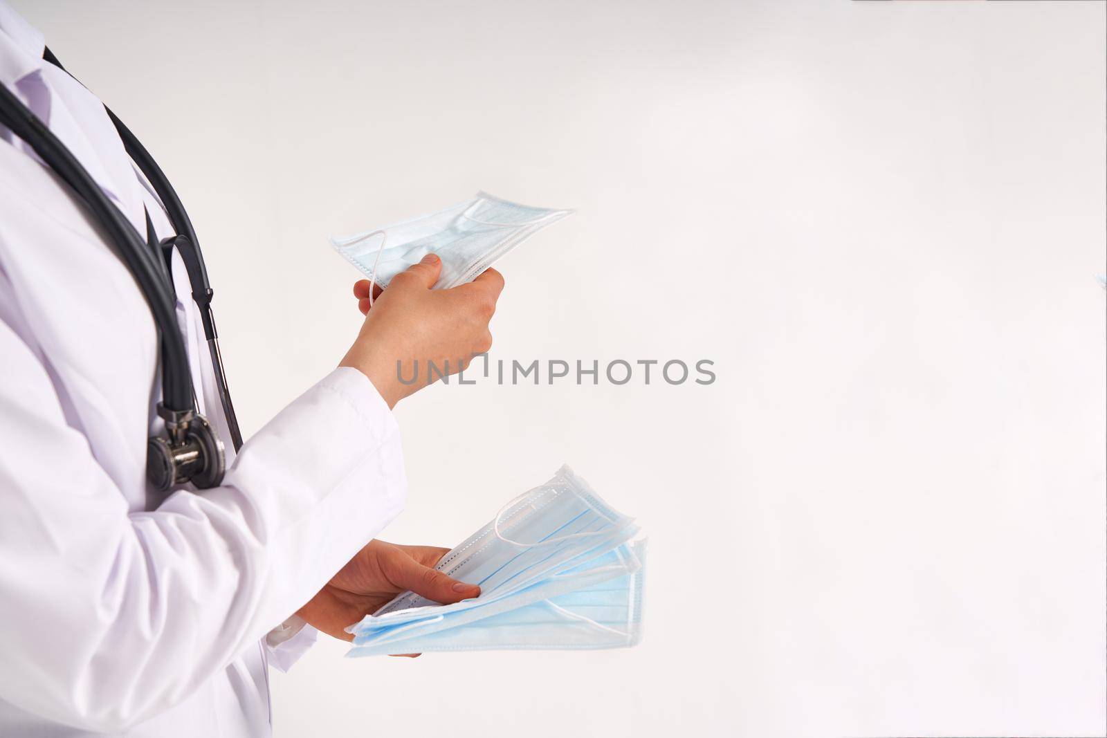 Doctor or nurse recommend to use protective face mask to protect from virus infection
