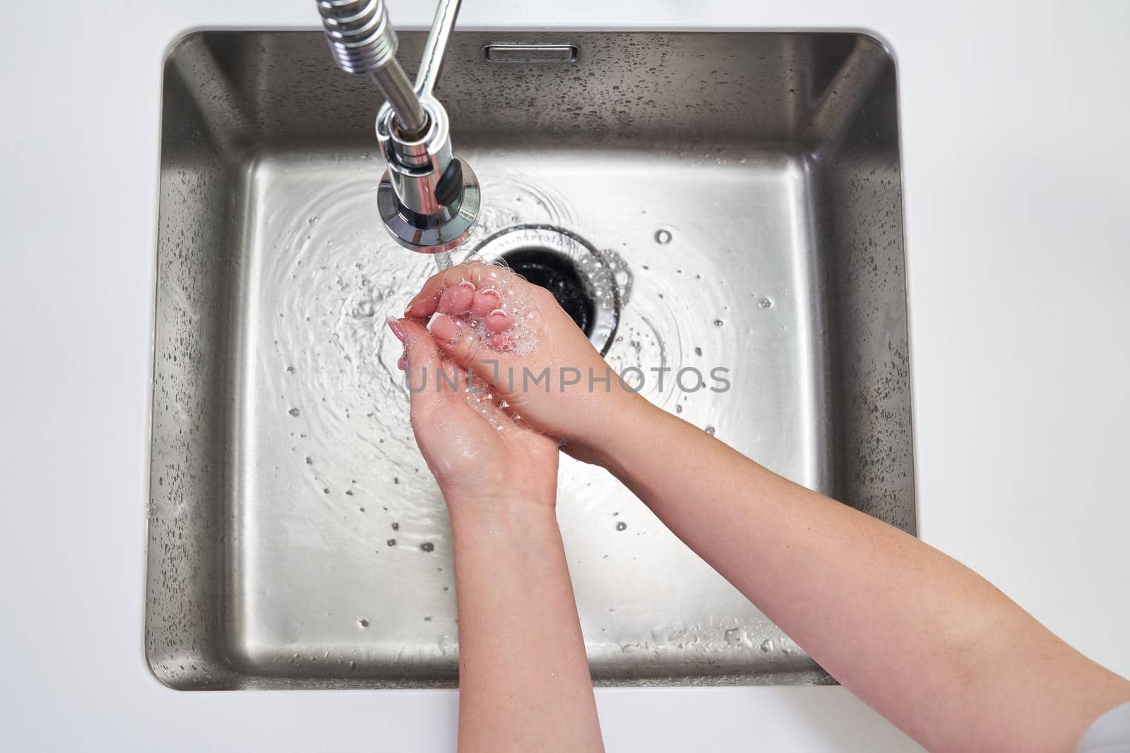 Woman washing hands with antibacterial soap for corona virus prevention, hygiene to stop spreading coronavirus covid19