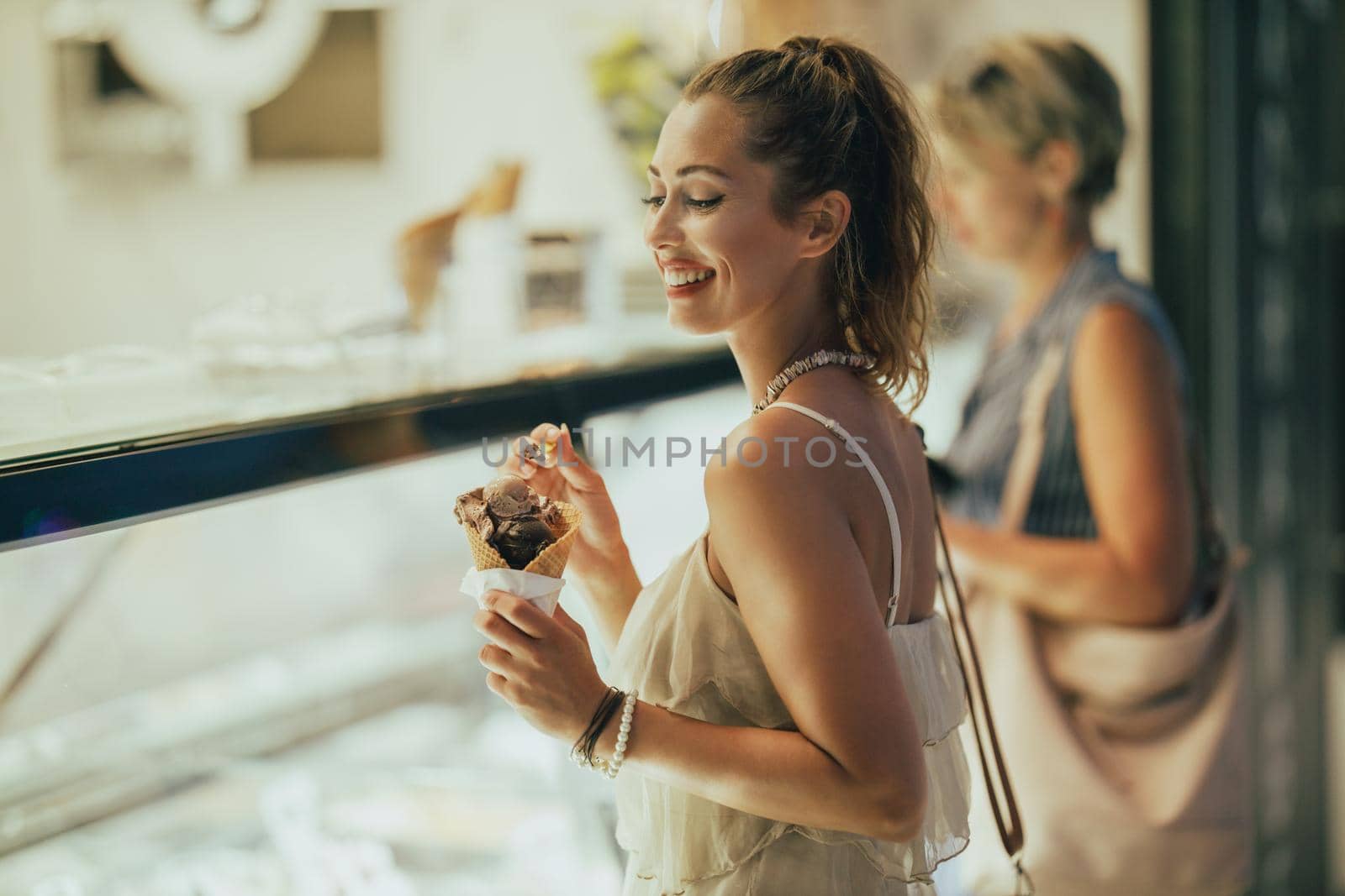 Portrait of an attractive young woman enjoying an ice cream.