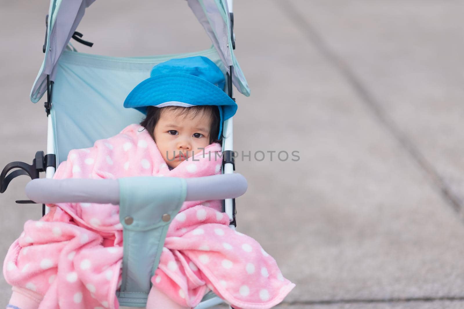 portrait of cute baby sitting on the chair