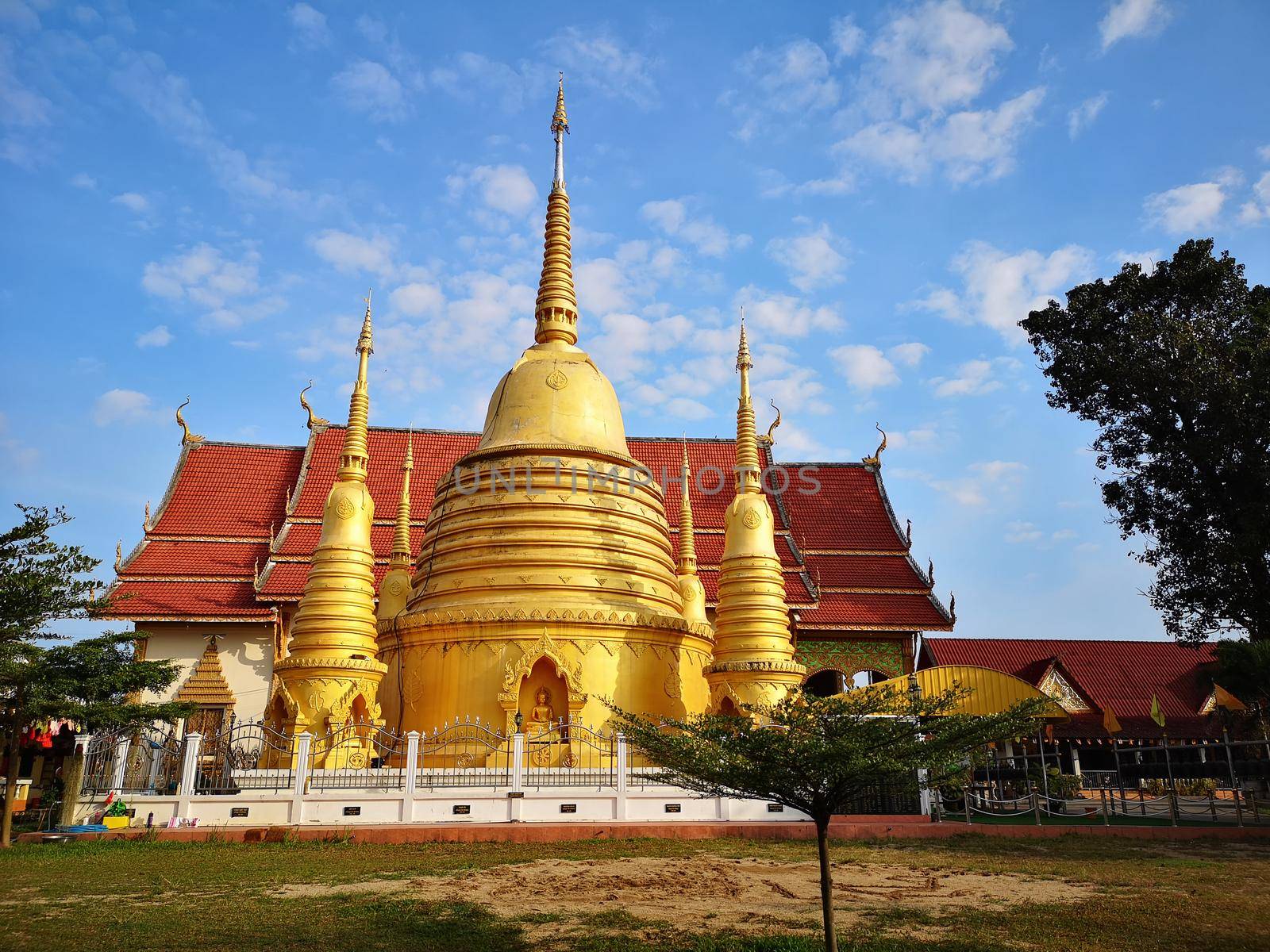 temple and blue sky in chiang rai Thailand by Wmpix