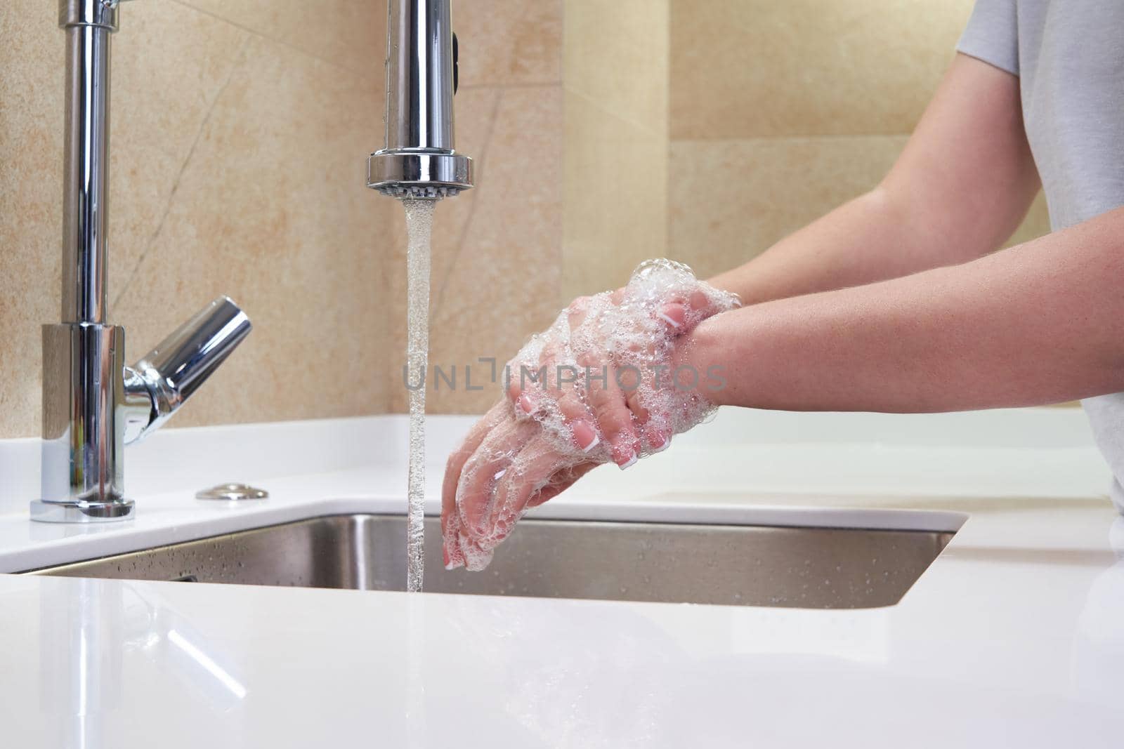 Woman washing hands with antibacterial soap for corona virus prevention, hygiene to stop spreading coronavirus covid19