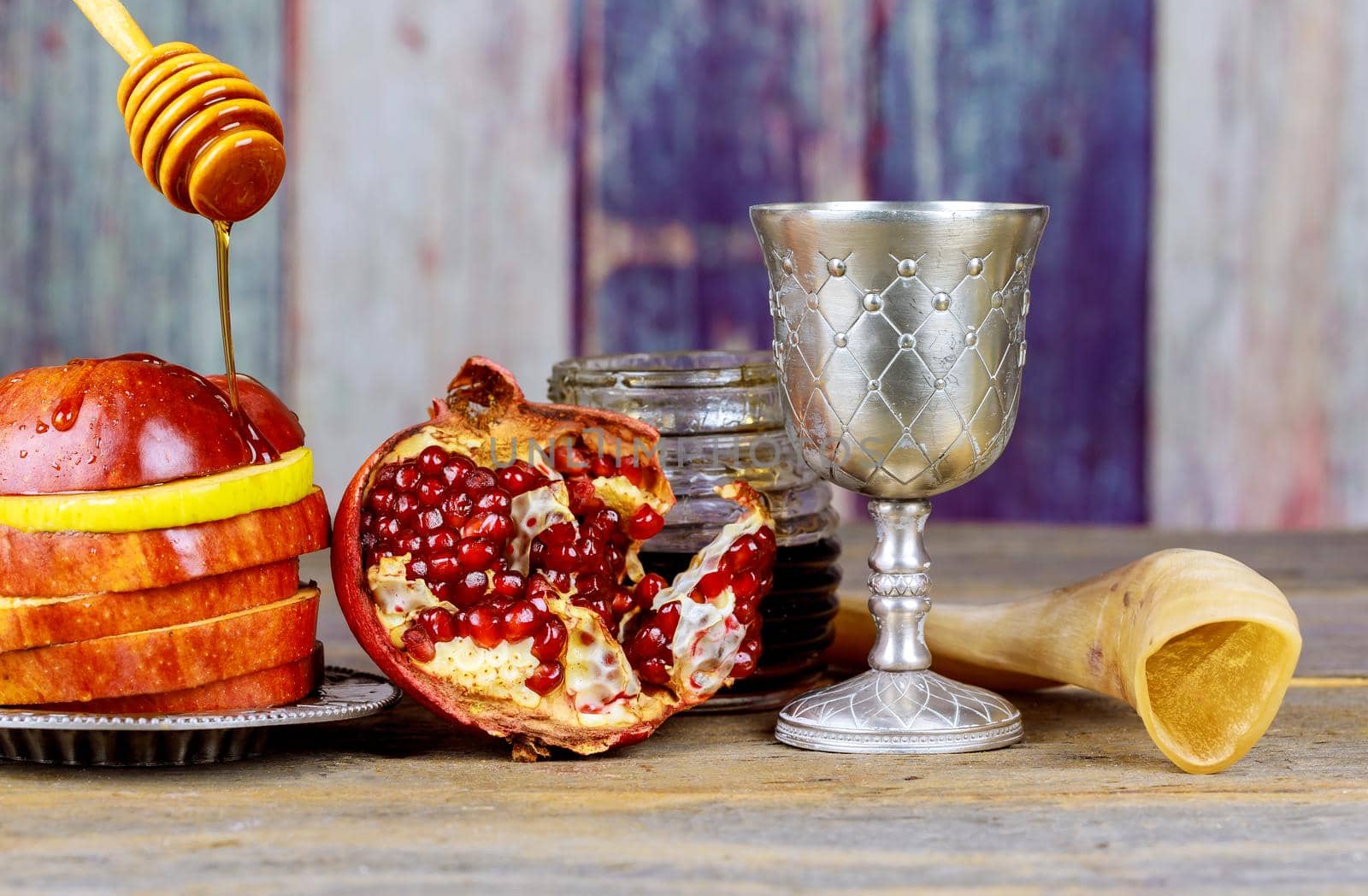 Traditional holiday symbols Jewish New Year Rosh Hashanah celebration on festive table by ungvar