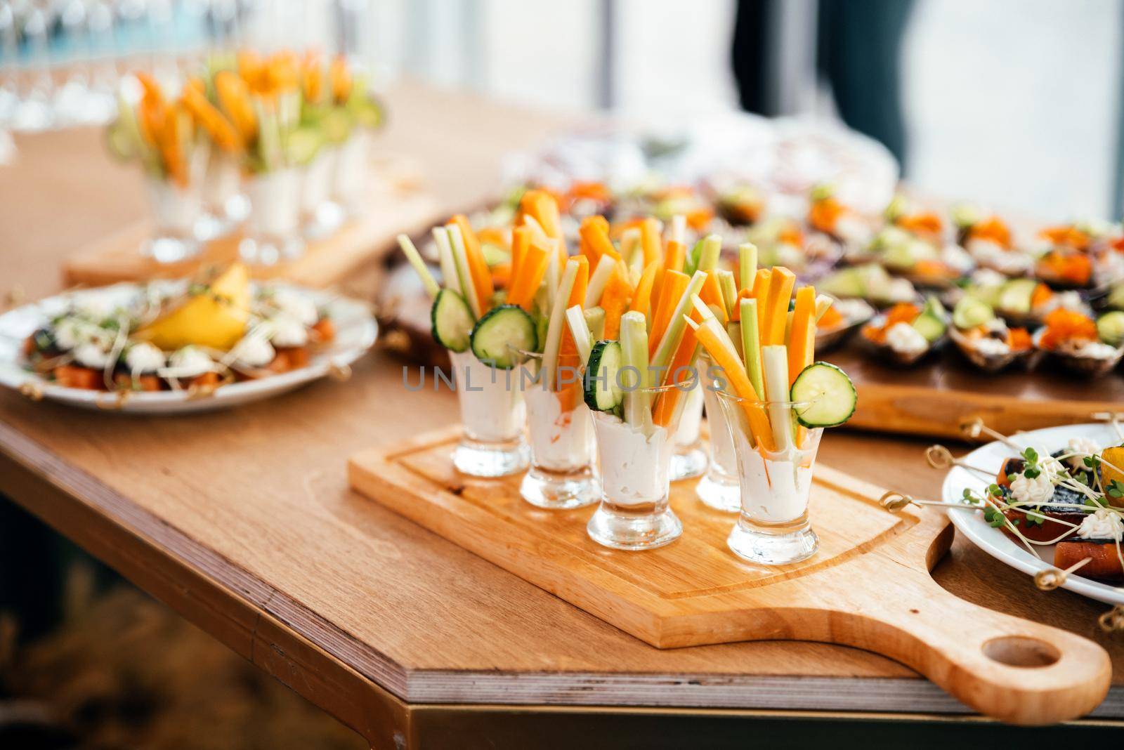 individual vegetarian Cocktail shots with yogurt savory sauce