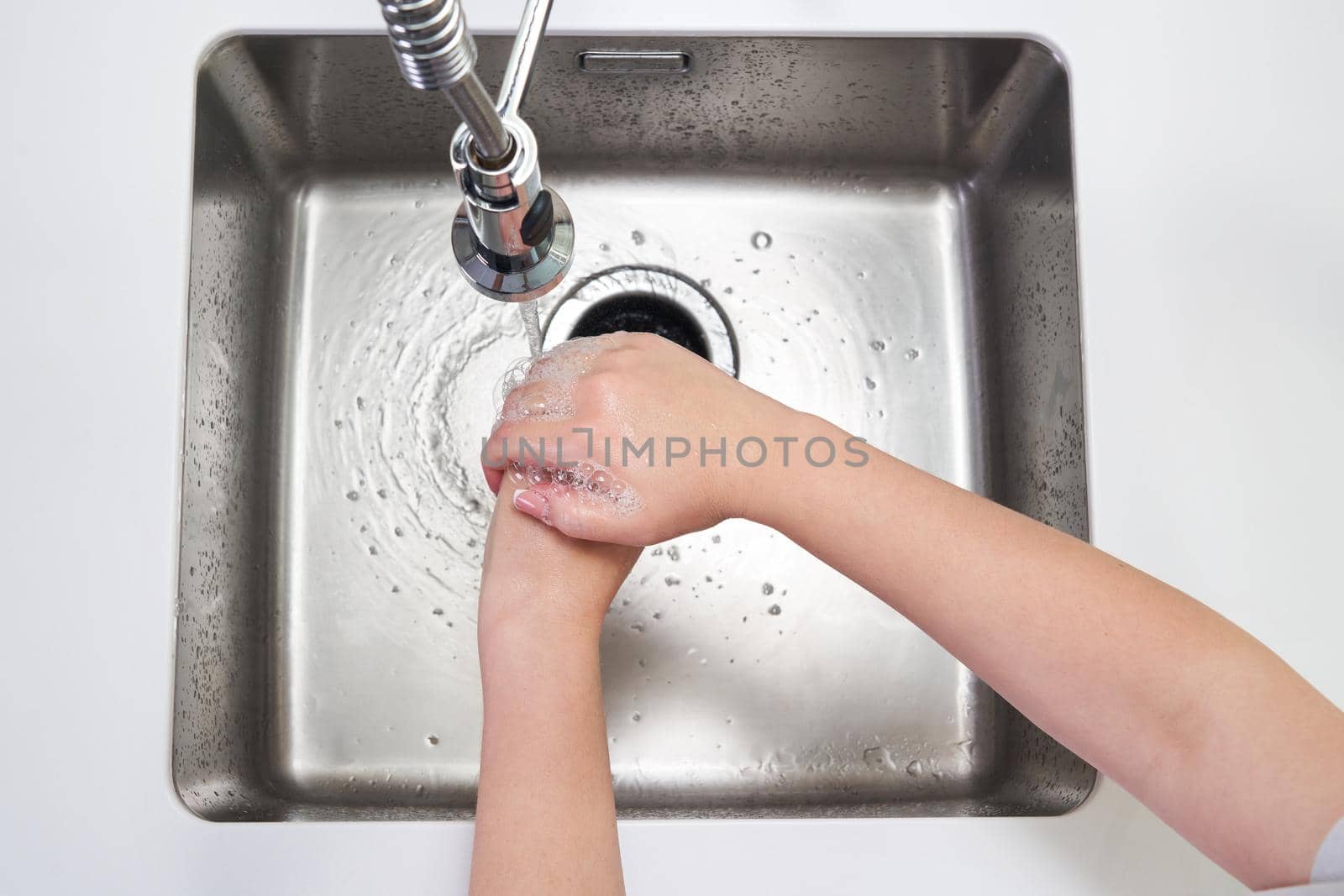 Woman washing hands with antibacterial soap for corona virus prevention, hygiene to stop spreading coronavirus covid19