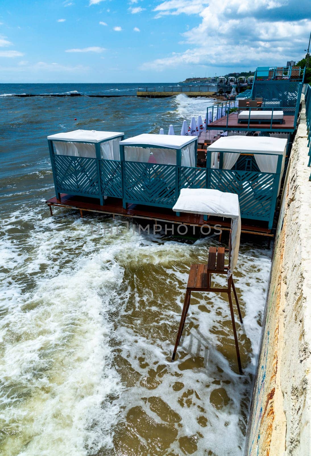 empty places to rest on a washed-out beach after the explosion of the Kakhovskaya hydroelectric power station in Odessa  by Hydrobiolog