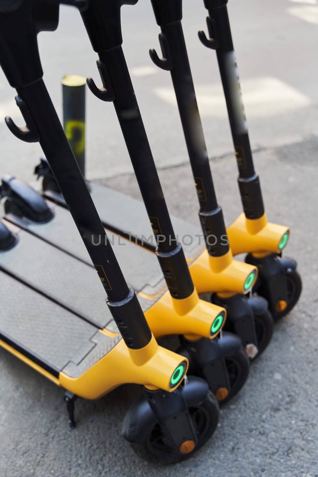 Electric scooters for rental . Vehicle rent service background. Electric kick scooters for transportation by driver-s
