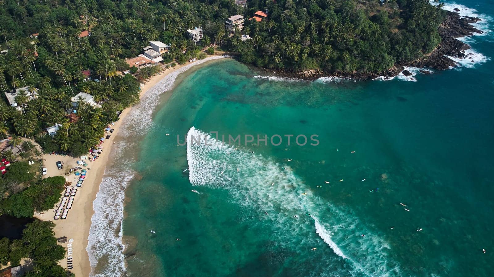 Aerial view of Hiriketiya Beach in Dikwella. Blue beach in Sri Lanka. Indian Ocean by driver-s