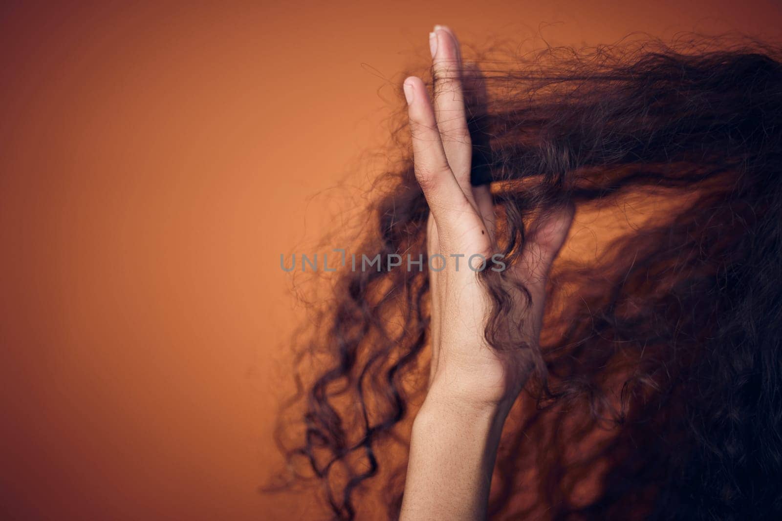 Mockup, closeup and woman with hair care, fingers and salon treatment for volume, texture and grooming. Zoom, female person and model with scalp massage, curls and beauty against a studio background by YuriArcurs