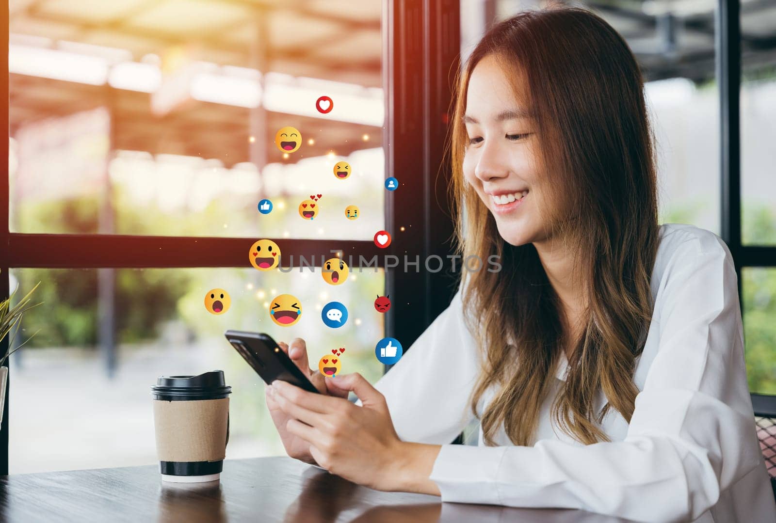 Asian woman using mobile phone, social media interaction concept with like, comment, and message icons above smartphone screen, Social media
