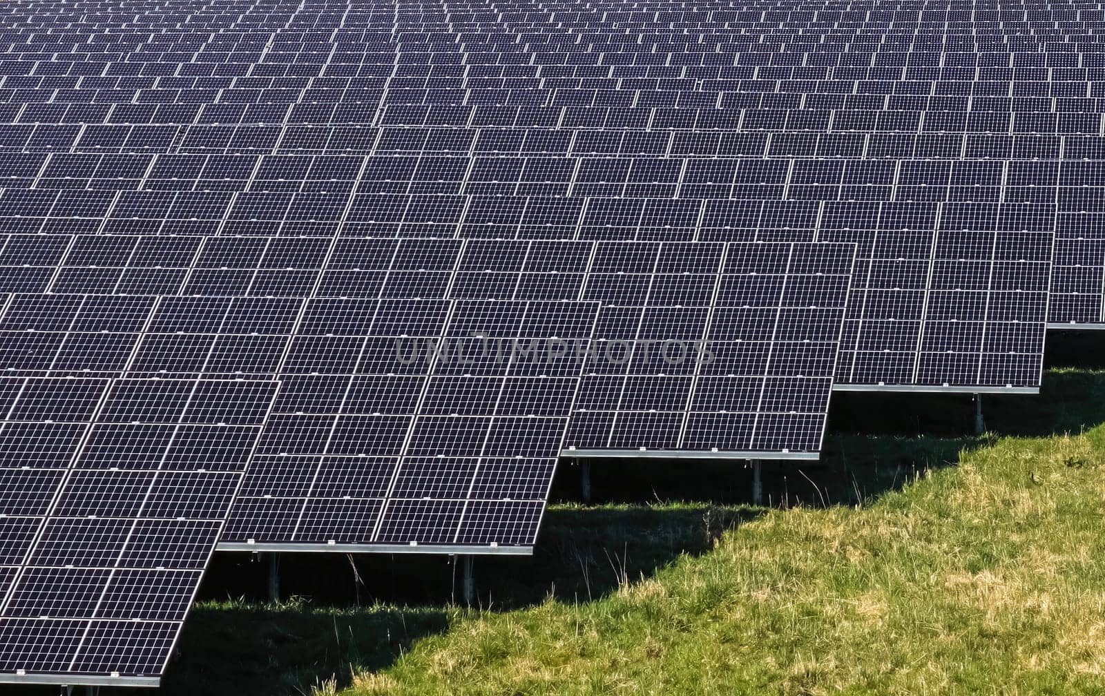Generating clean energy with solar modules in a big park close to the Highway A7 in northern Germany. by MP_foto71