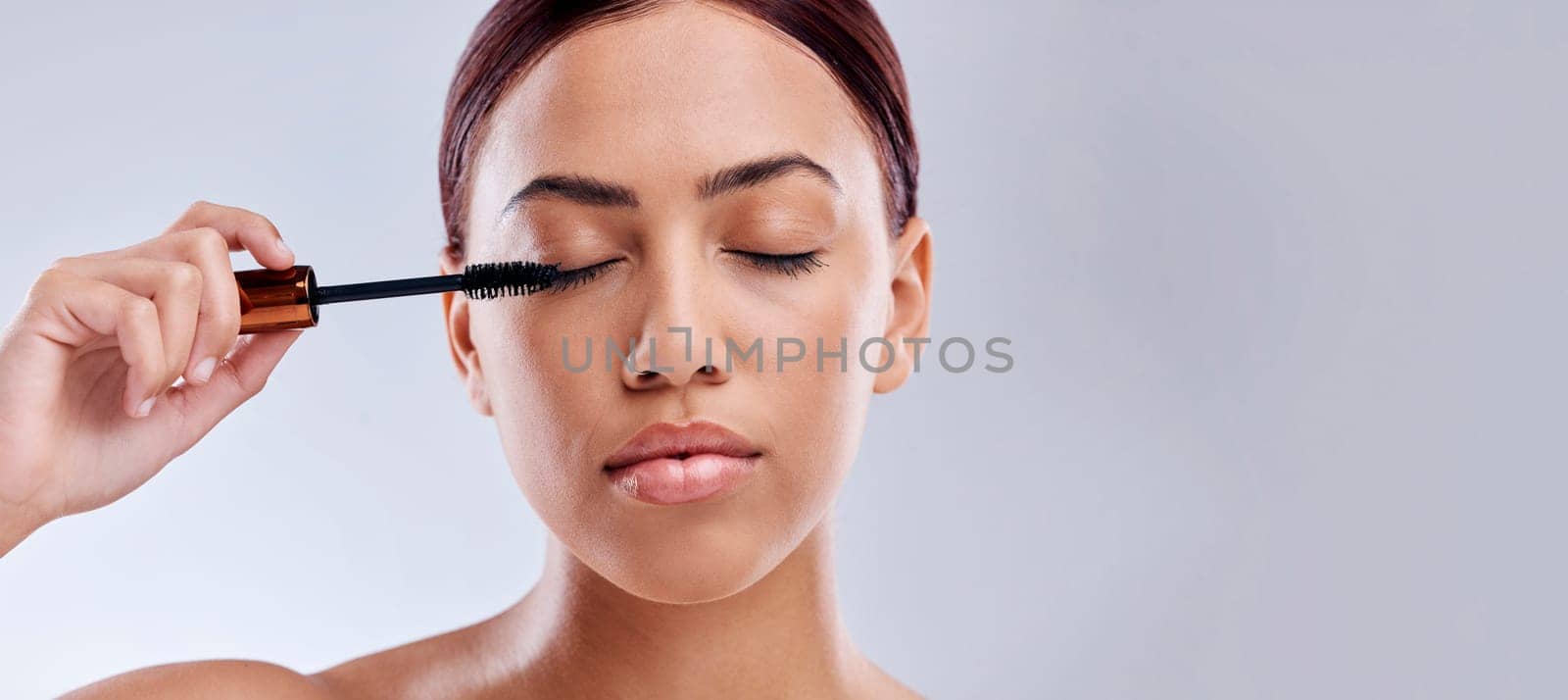 Eyelash extension, mockup or girl with mascara makeup, cosmetics or product brush for grooming in studio. Beauty, mock up space or beautiful woman with eyelashes tool for make up on white background by YuriArcurs