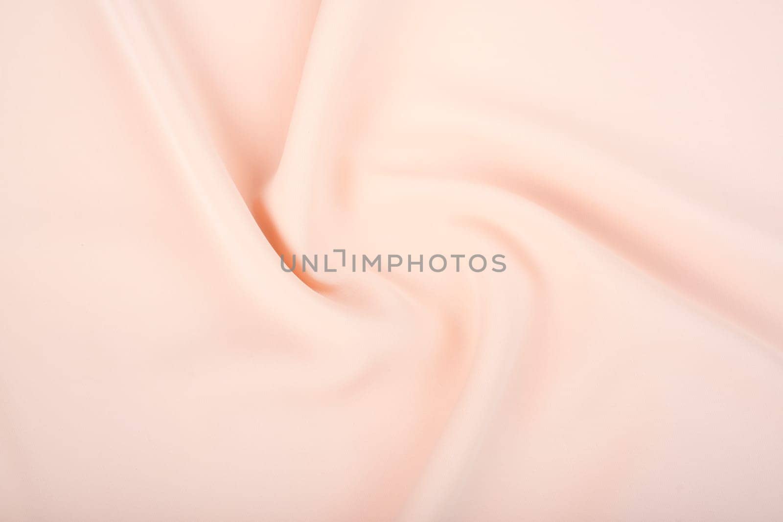 Texture of the satin fabric of beige color for the background