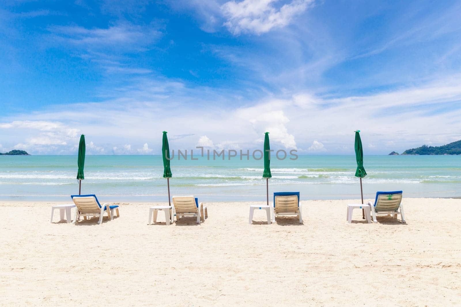 Chairs And Umbrella on the Beach - Tropical Holiday.