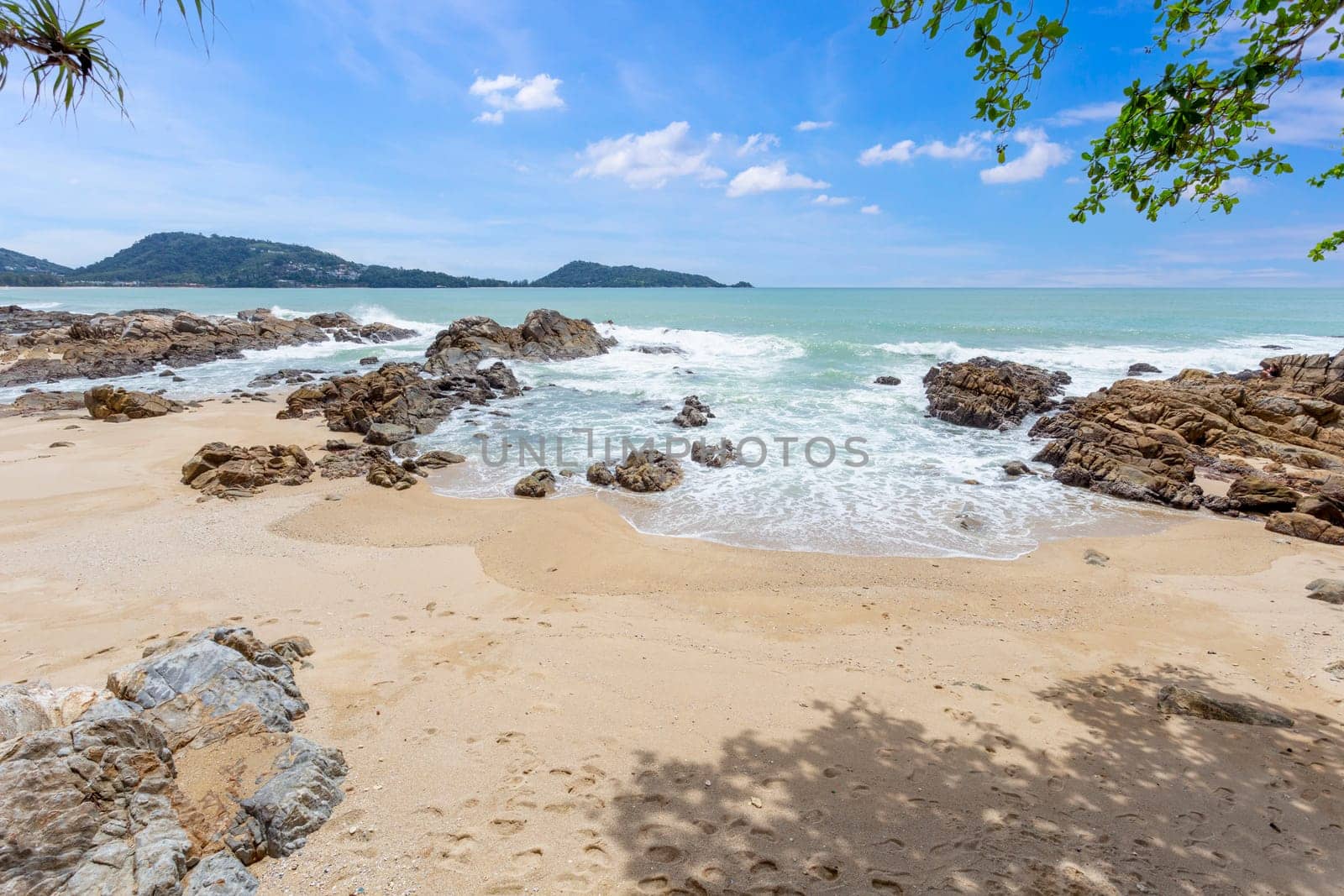 The Summer holiday and vacation background concept of beautiful leaves frame trees on tropical beach in summer season by Gamjai