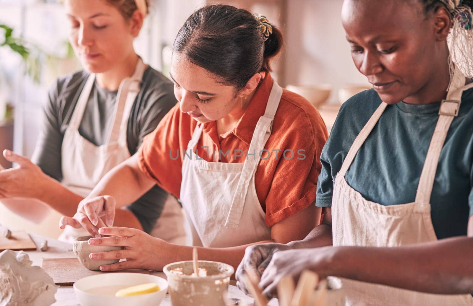 Pottery class, creative workshop or people design sculpture mold, manufacturing or art product. Diversity women, ceramic retail store or startup small business owner, artist or studio group molding.