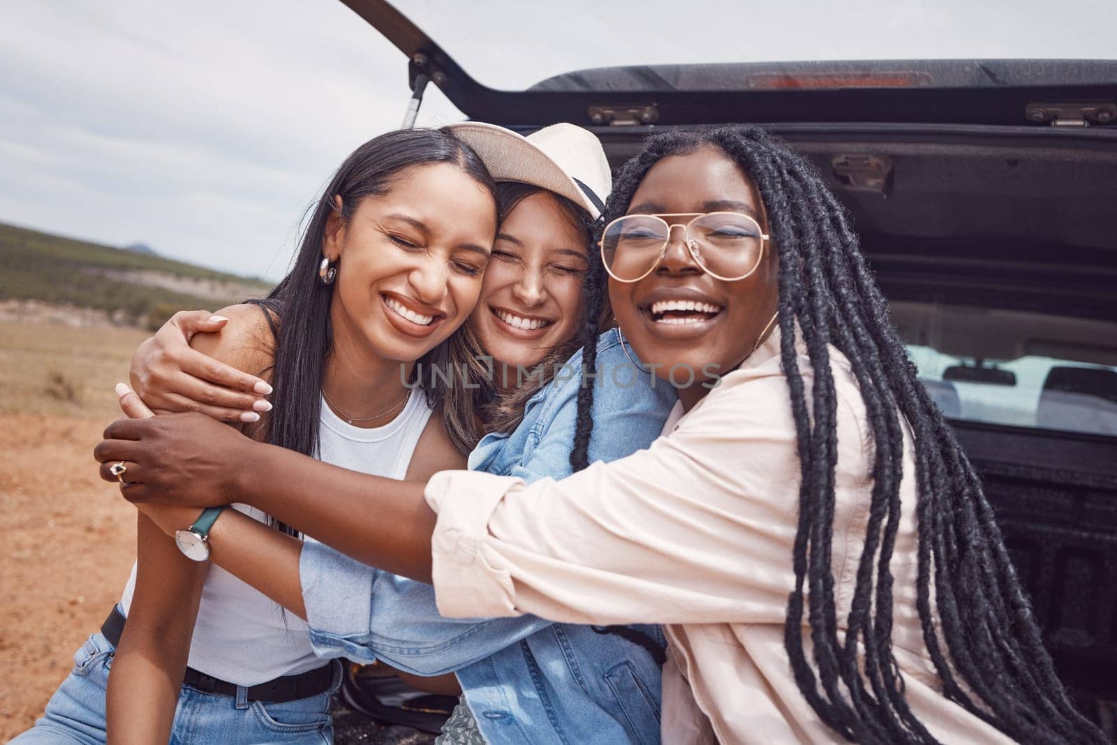 Happy, smile and hug with friends on road trip in countryside for freedom, vacation and summer break. Travel, holiday and bonding with women relax in car for adventure, journey and transportation.
